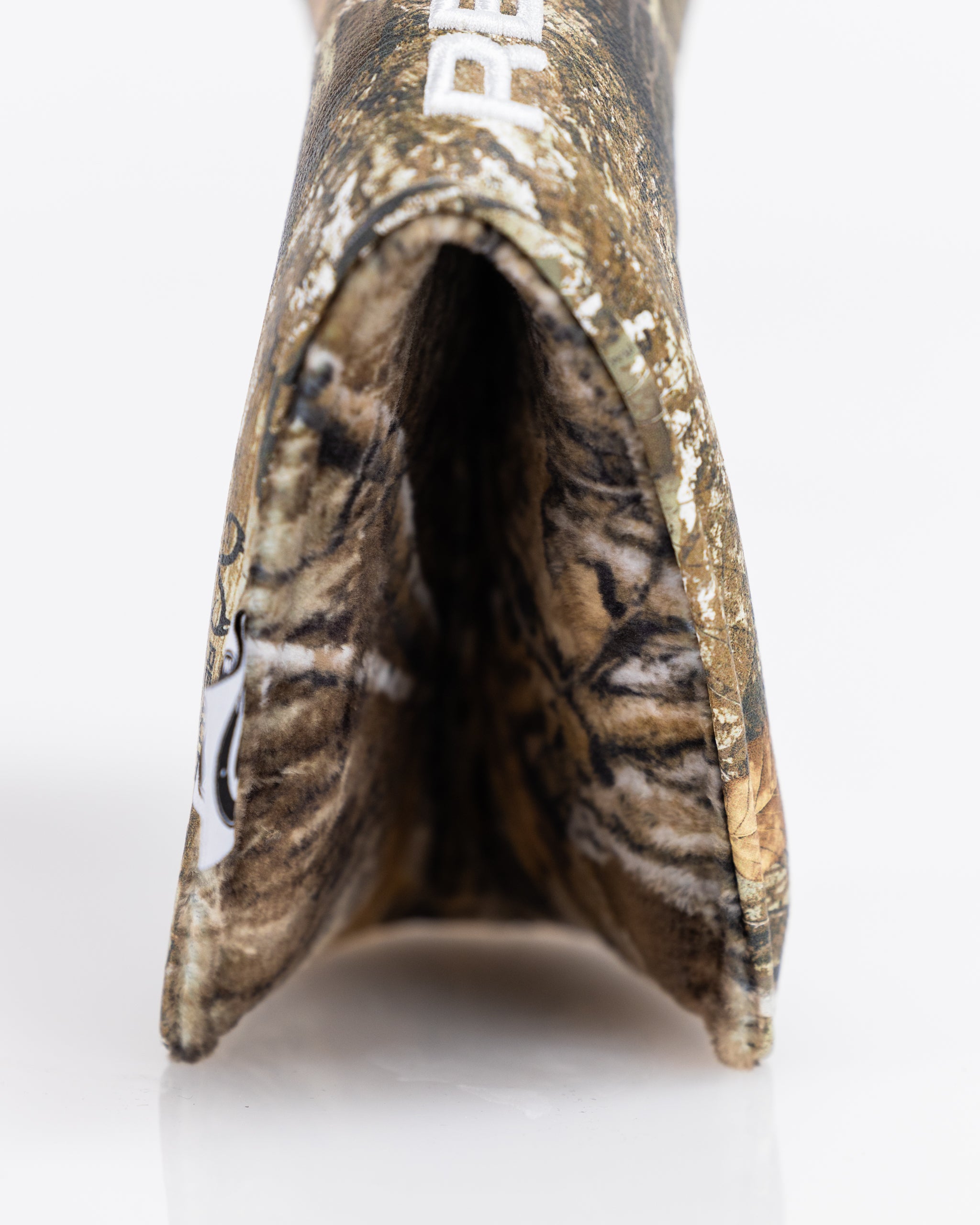 Realtree camo blade putter cover designed for golf clubs, featuring a rugged outdoor aesthetic.