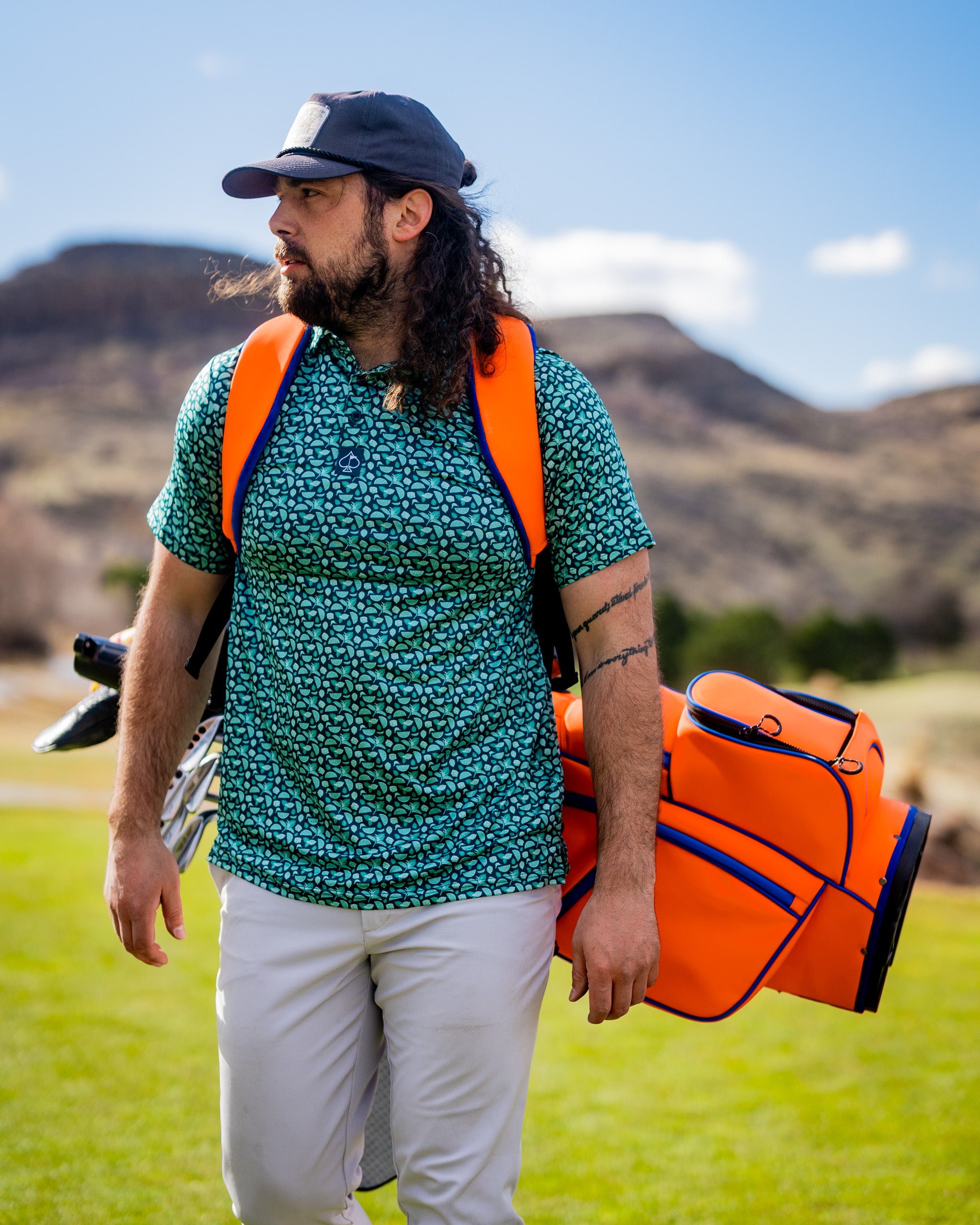Player Preferred™ Golf Bag in Orange Crush, featuring a vibrant orange design, multiple pockets, and a comfortable shoulder strap.