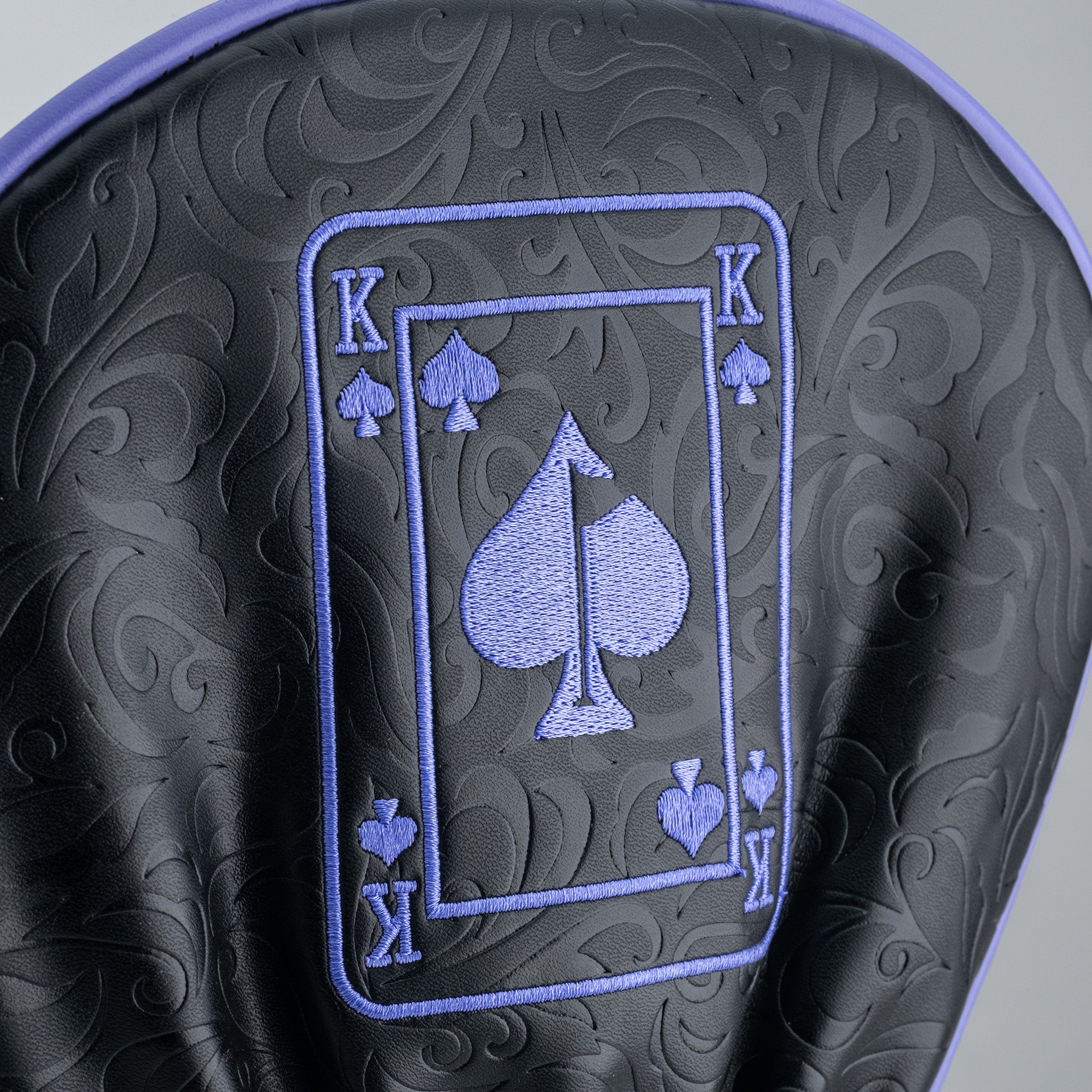 Royal Flush Headcover Set featuring a stylish black design with purple embroidered playing card motifs for golf clubs.