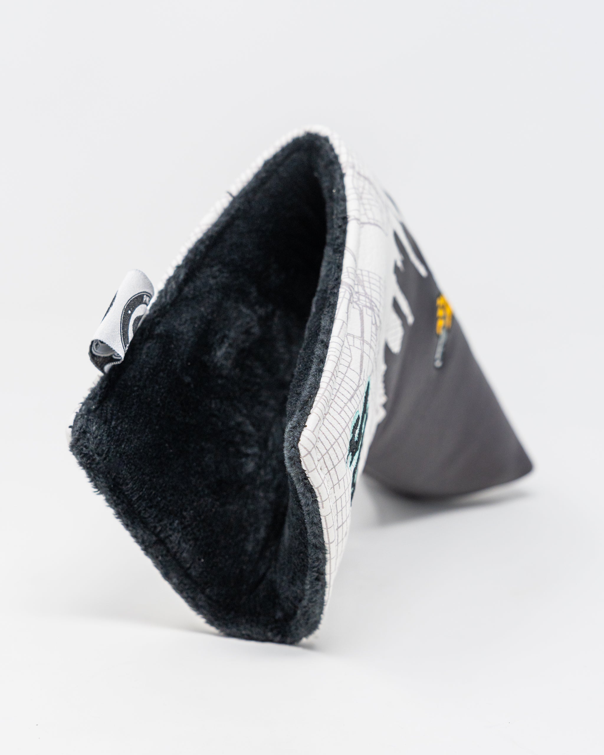 Shady Slice Blade Putter Cover featuring a vibrant design and durable construction, ideal for golf enthusiasts.