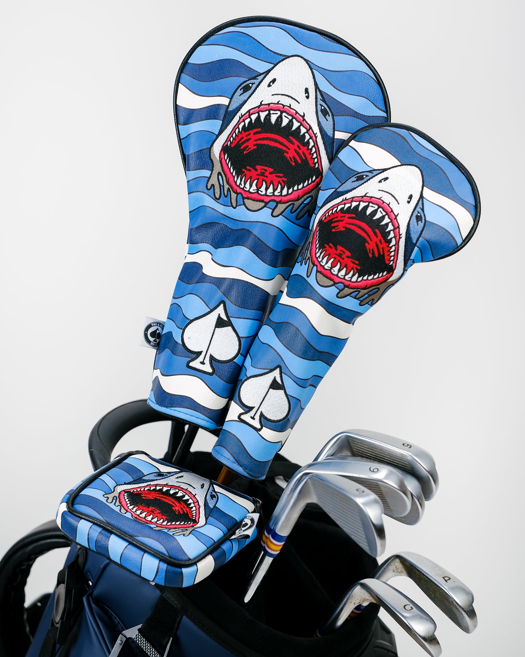 Shark Attack Driver Cover featuring a shark design, bright colors, and a sleek fit, ideal for golf enthusiasts.