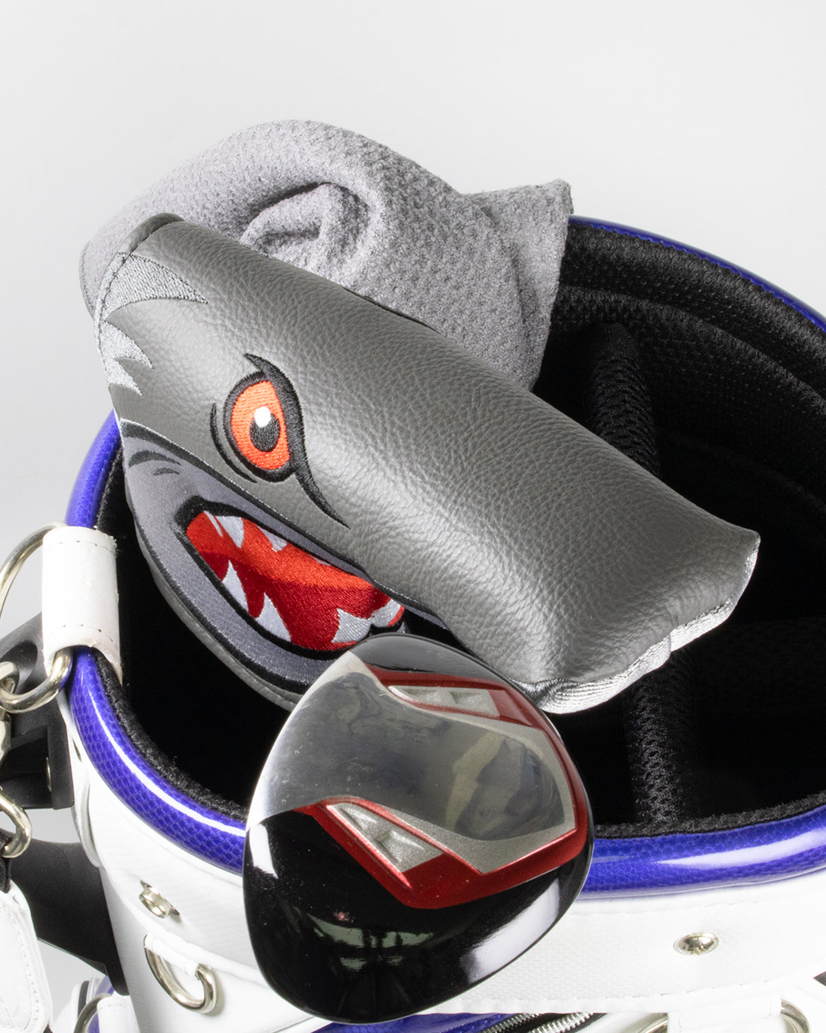 Golf headcover with a fierce shark design, gray and black colors, and bold red and white teeth.