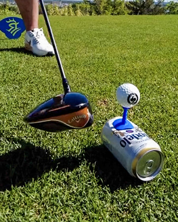 Three blue Shottee golf tees arranged in a row on a green grass background.
