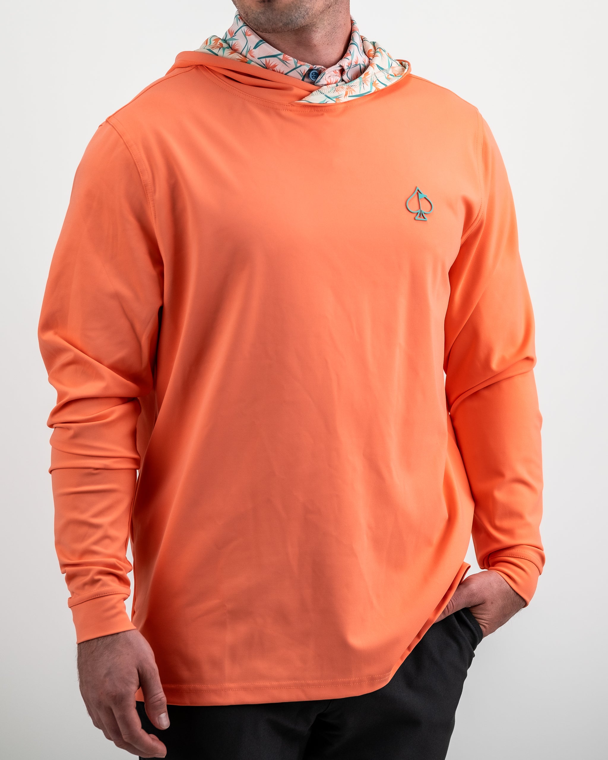 Performance Golf Hoodie featuring a vibrant Birds of Paradise design in bold colors, ideal for outdoor activities.