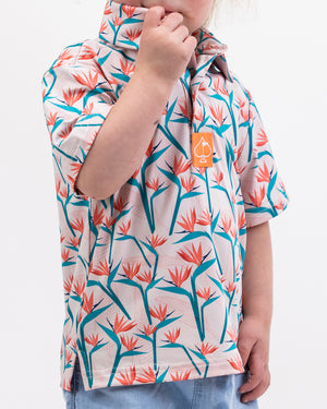 Youth Birds of Paradise colorful children's dress featuring vibrant floral patterns and short sleeves.