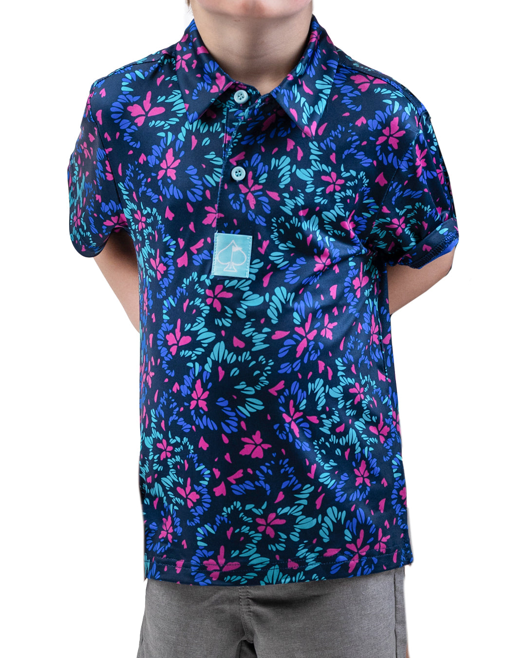 Youth fluorescent floral shirt with vibrant multicolored flower patterns on a bright background.