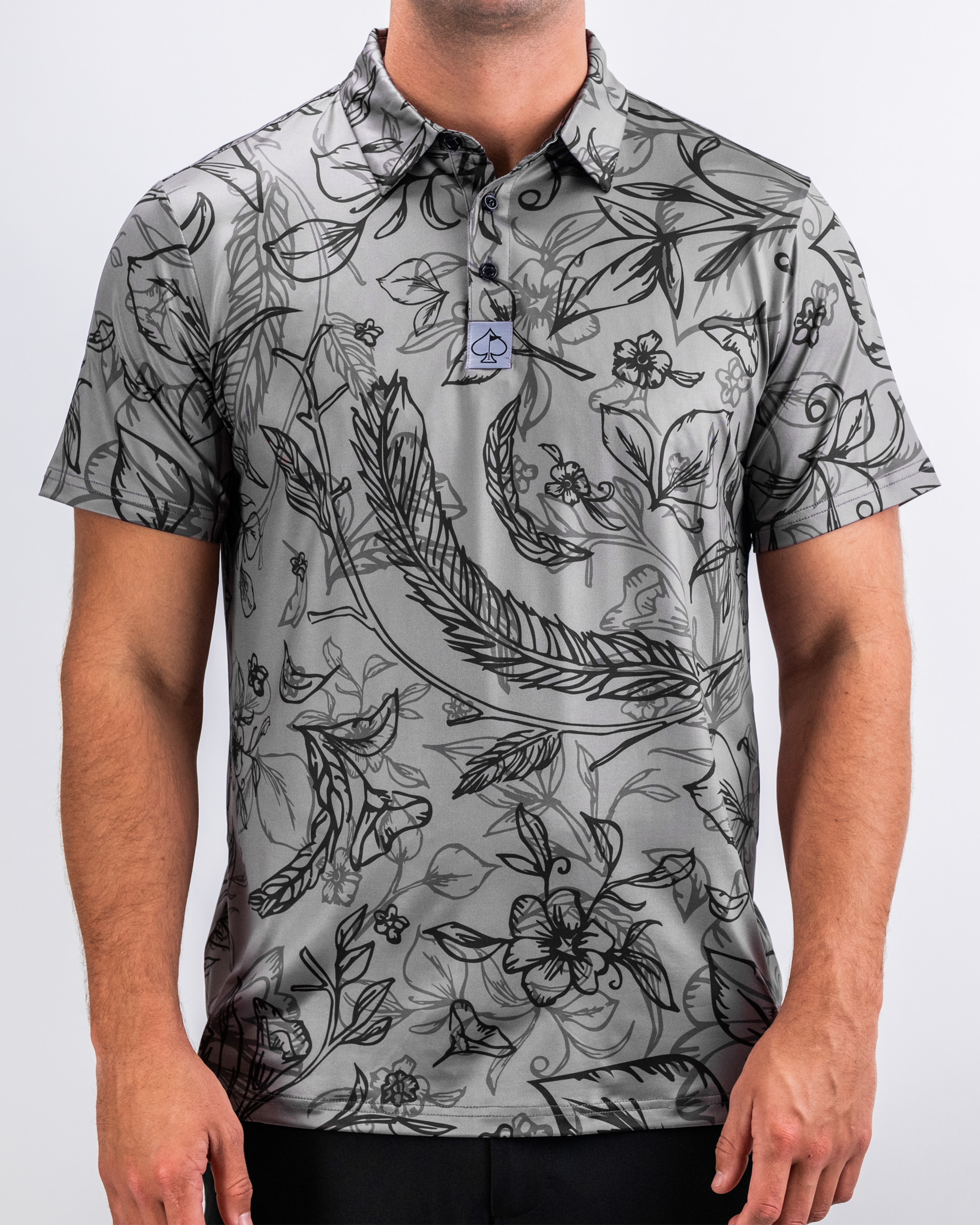 "Cabo Midnight stylish women’s swimwear set featuring a tropical print with dark blue and white accents."