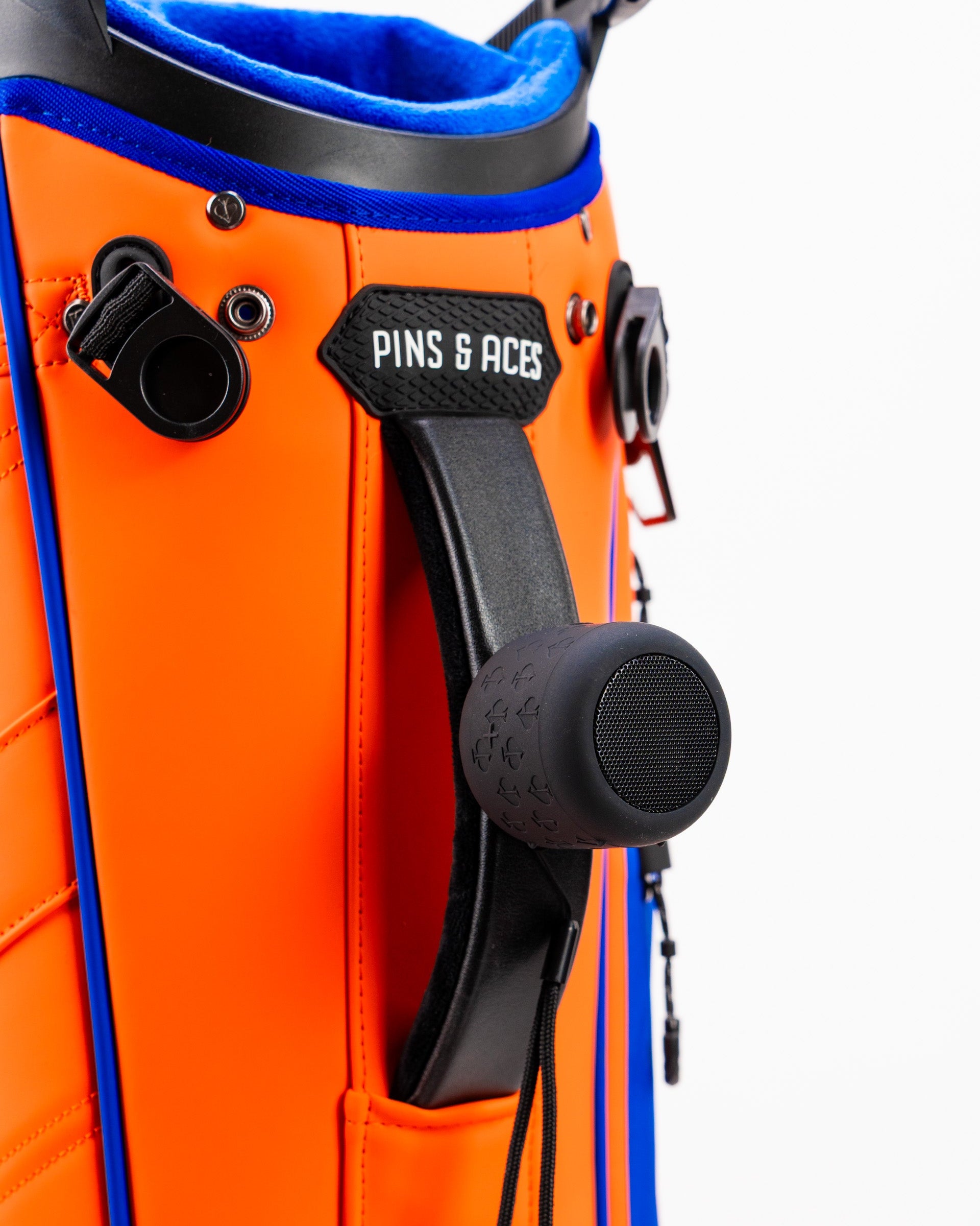 Player Preferred™ Golf Bag in vibrant orange color, featuring multiple pockets and a comfortable shoulder strap.