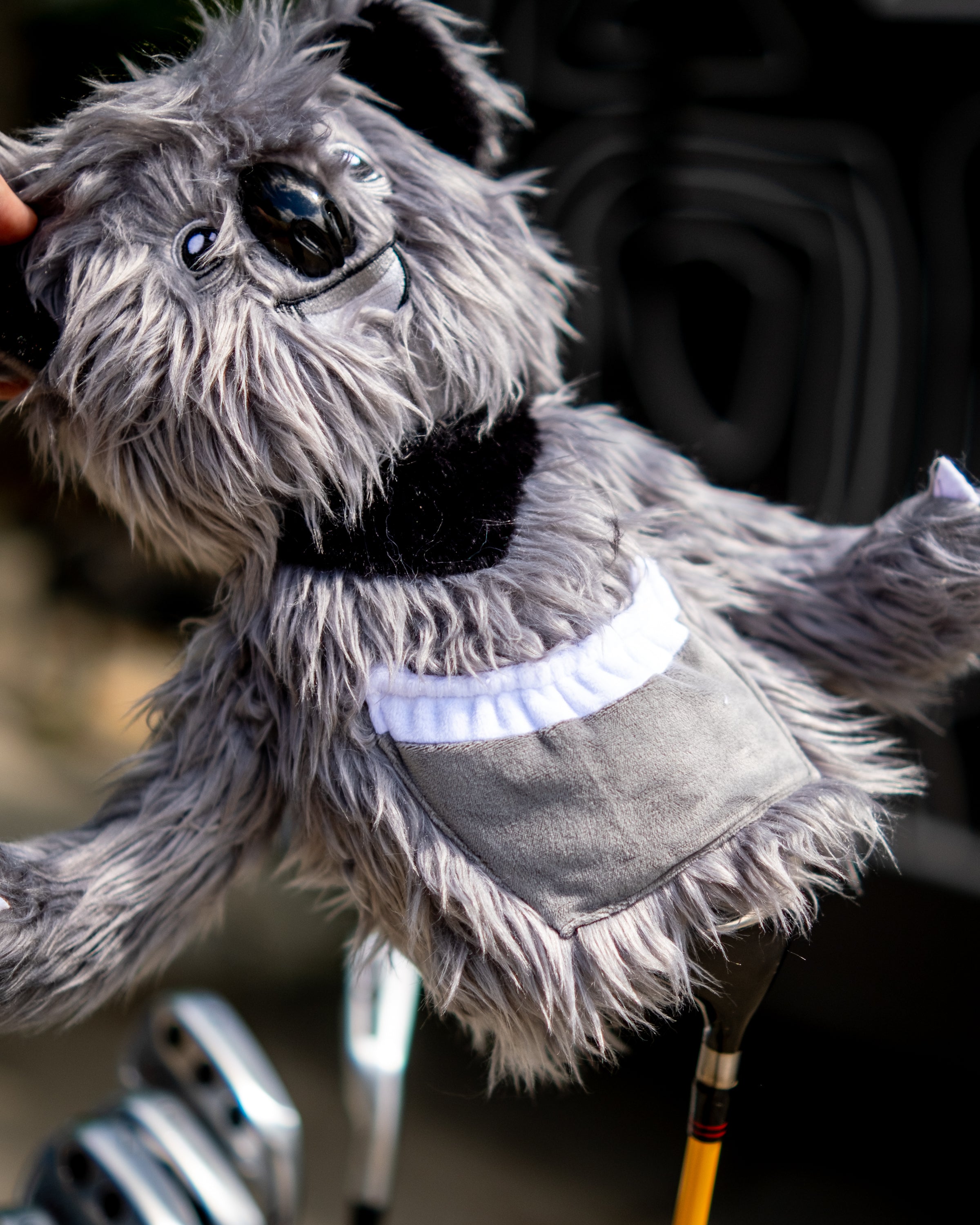 A plush koala-themed driver cover with detailed fur, black nose, and white chest patch, designed to fit golf club drivers.