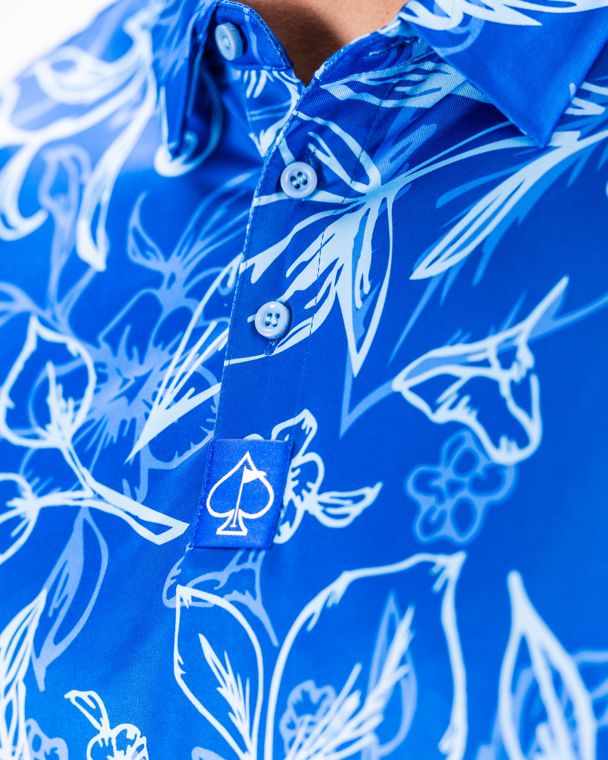 Men's Cabo Ocean shirt in a vibrant blue color, featuring short sleeves and a tropical print.