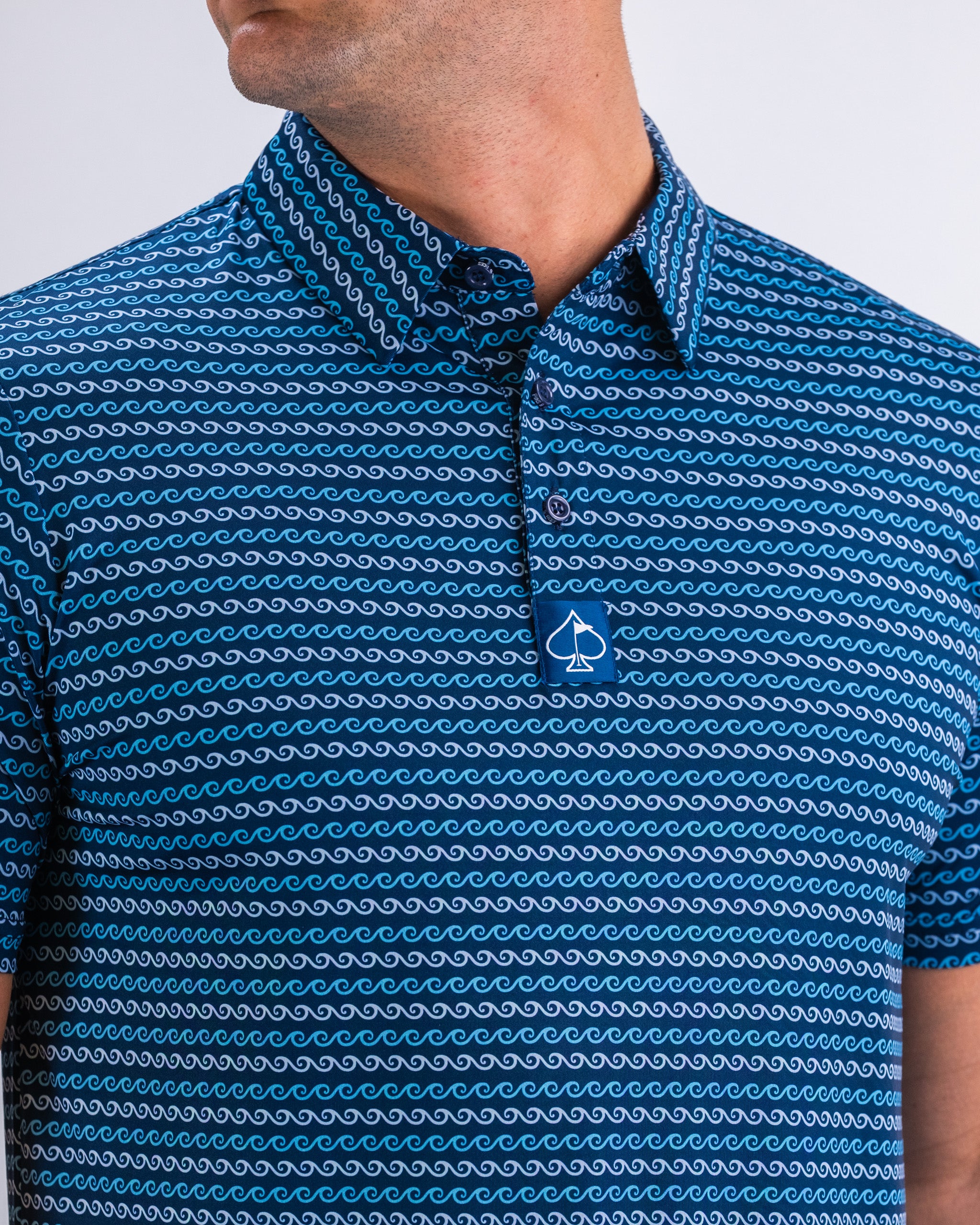 Men's long-sleeve shirt featuring a blue and white wave pattern, perfect for spring fashion.