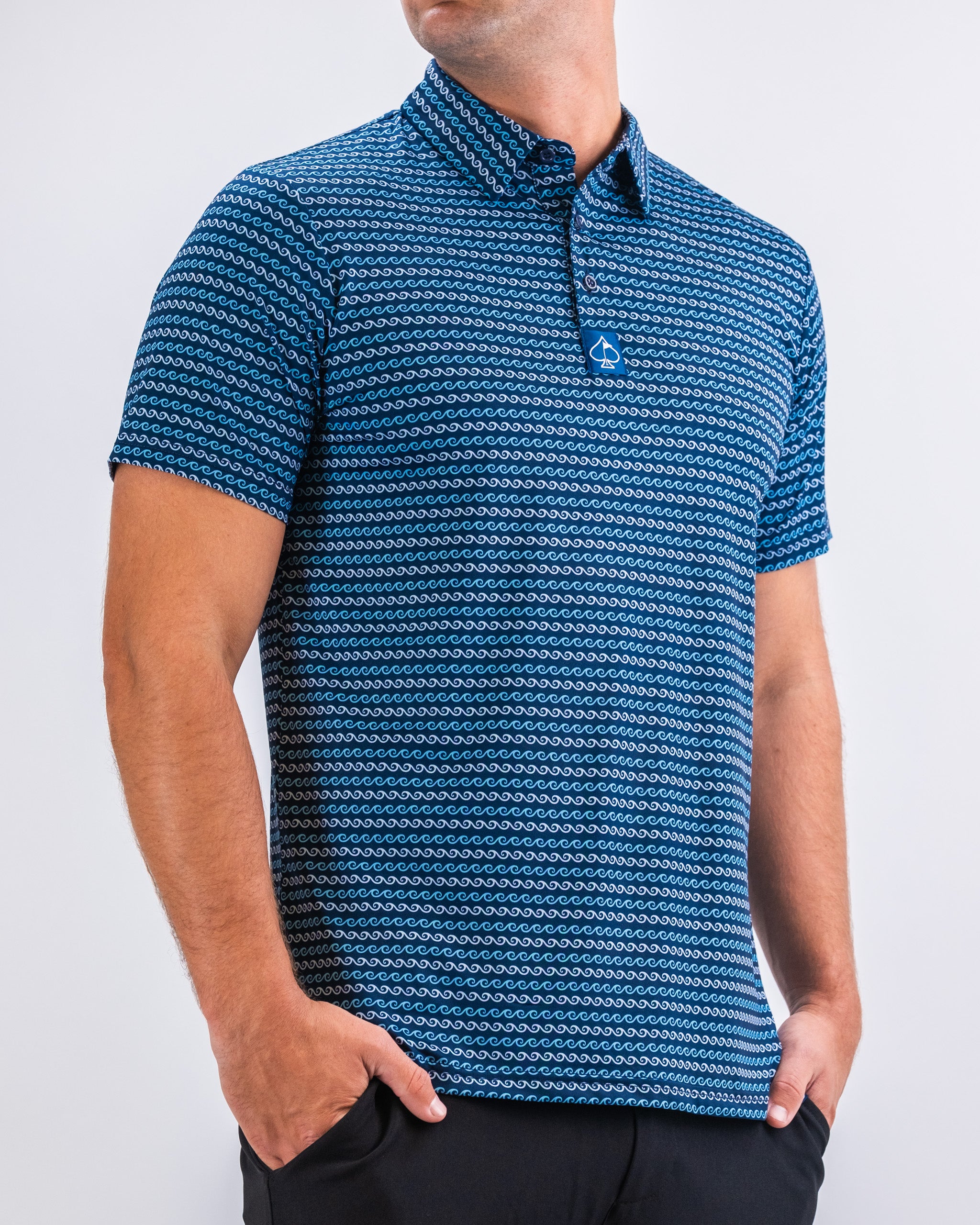 Men's Rising Tides shirt featuring a vibrant ocean-inspired design and short sleeves, displayed on a neutral background.