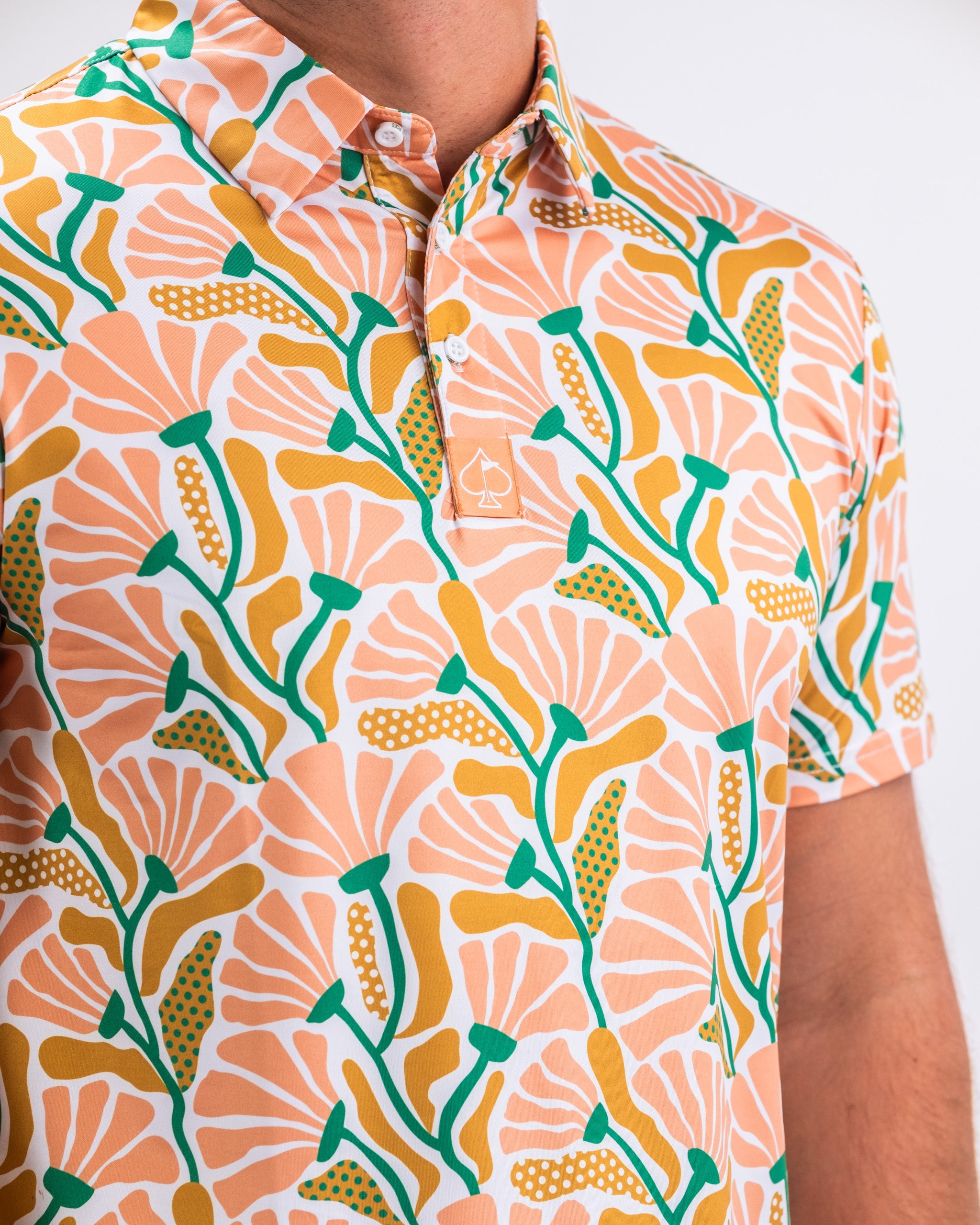 Garden Party Spritz: Men's light blue button-up shirt with floral print and short sleeves, ideal for spring events.