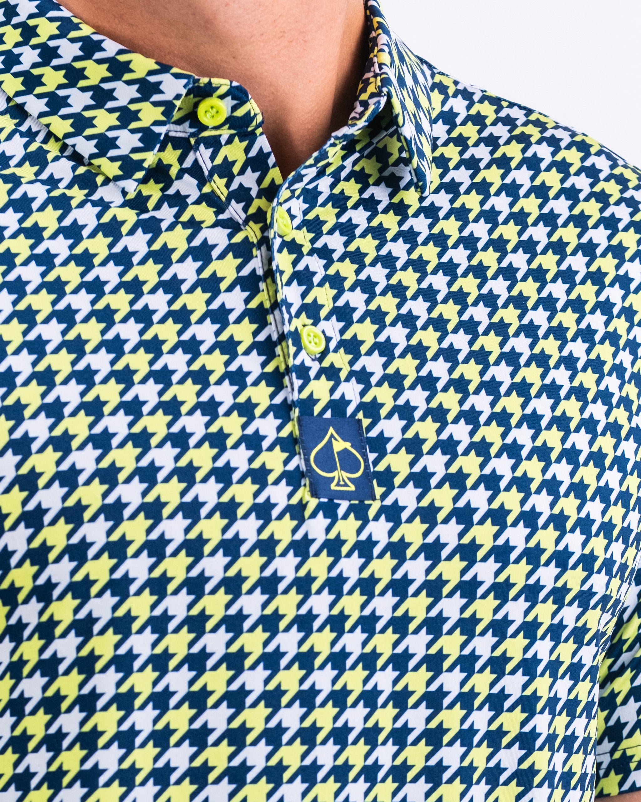 Houndstooth pattern fabric in lime green and black, showcasing a stylish design.