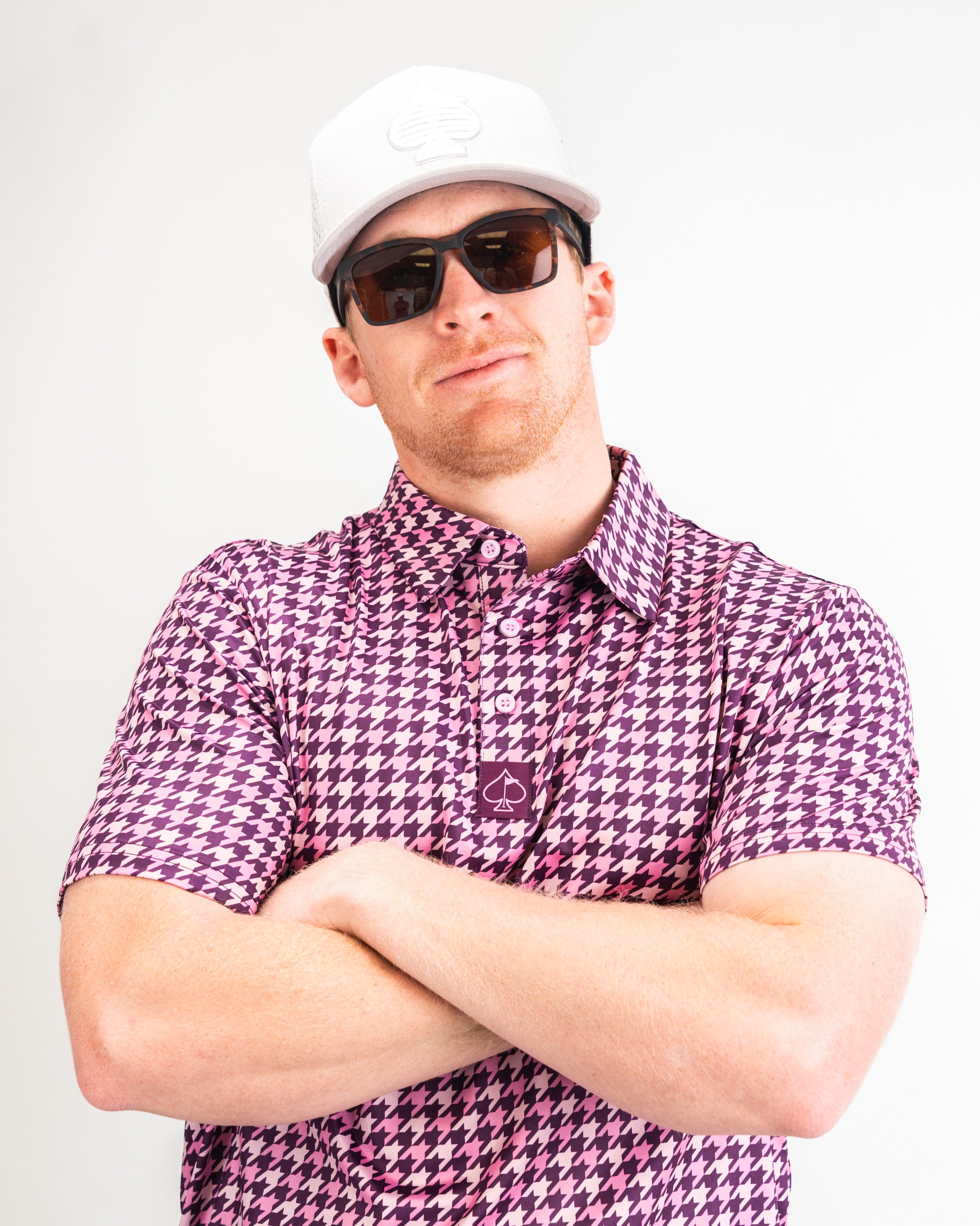 Houndstooth patterned fabric in raspberry color for men's fashion.