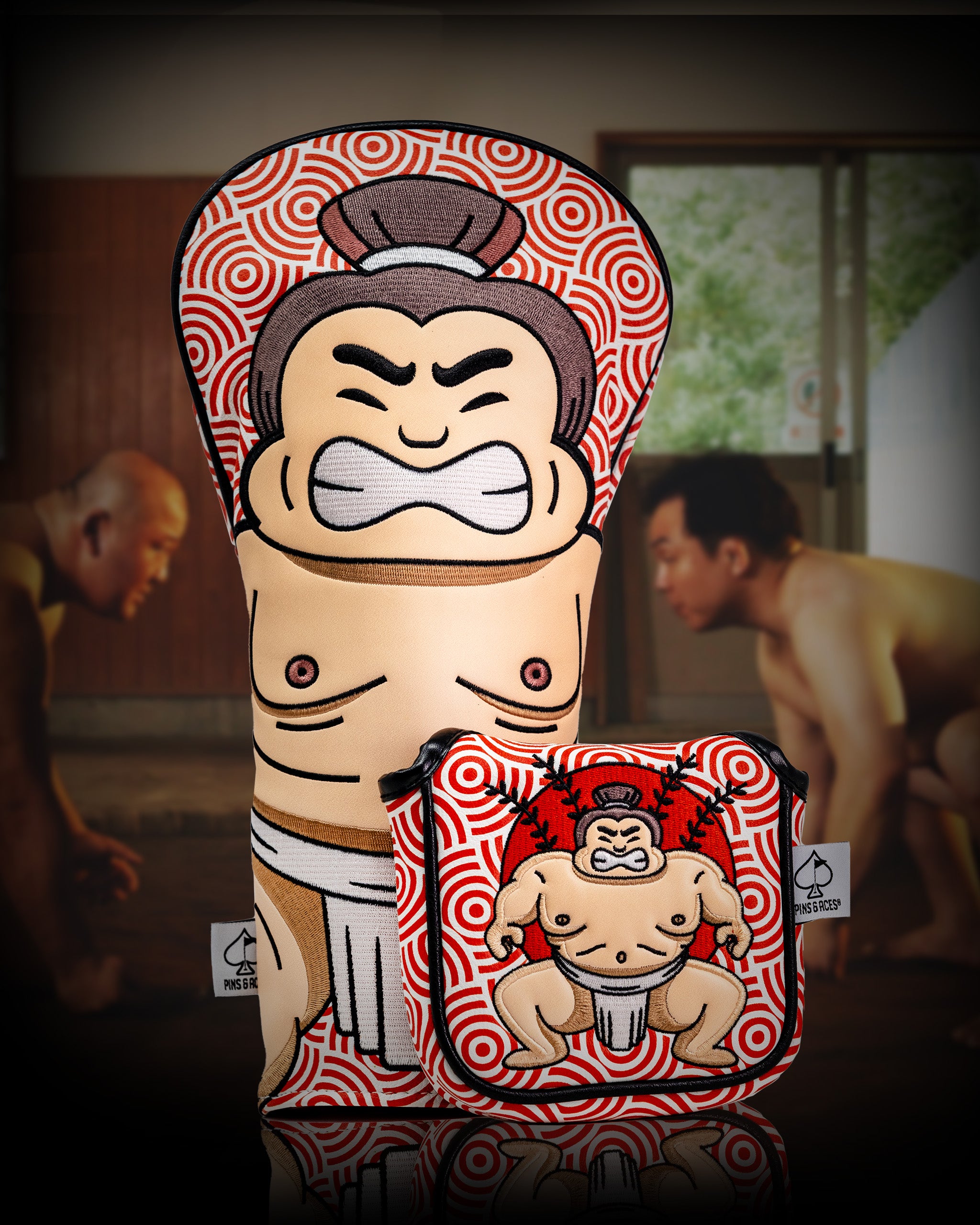 Sumo wrestler-themed driver cover with bold red and white spiral patterns, featuring a fierce sumo face and muscular body design.
