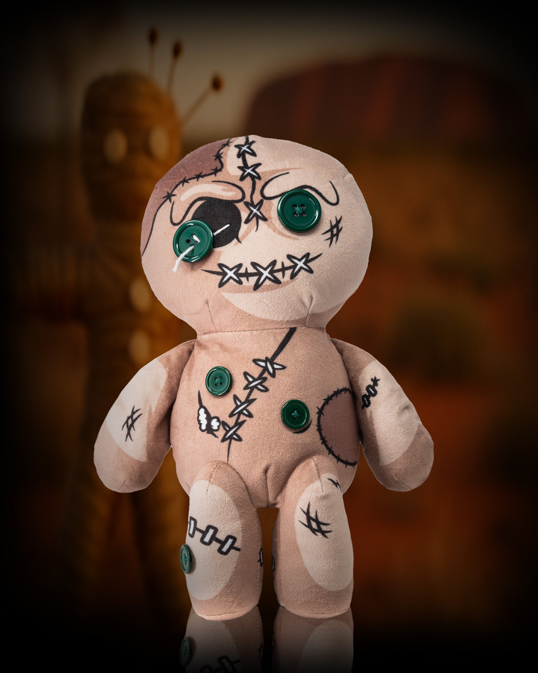 Soft fabric voodoo doll driver cover with stitched details and green buttons, designed for golf club protection.