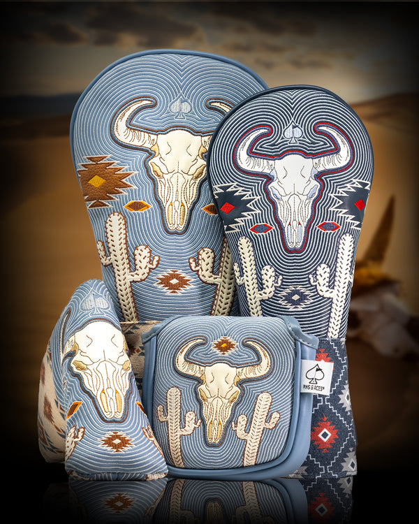 Bold cowboy skull and cactus embroidered golf accessories in blue, white, and red for standout course style.