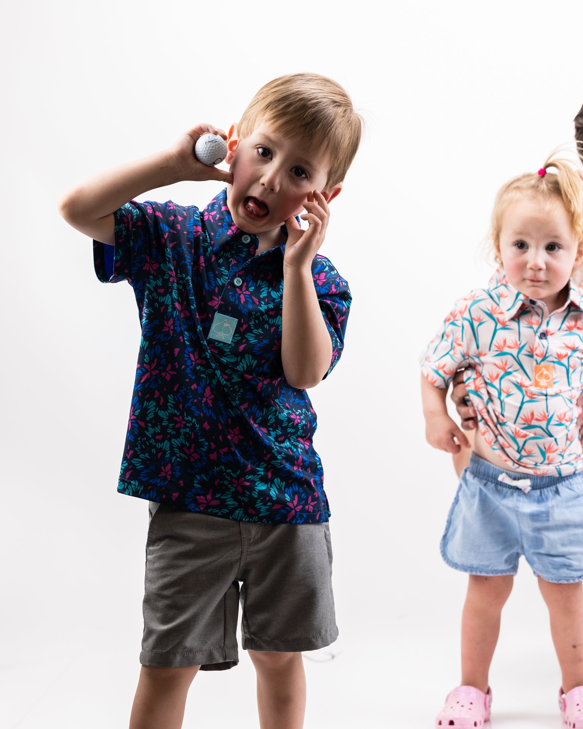 Youth fluorescent floral dress featuring vibrant colors and a playful pattern, perfect for spring outfits.