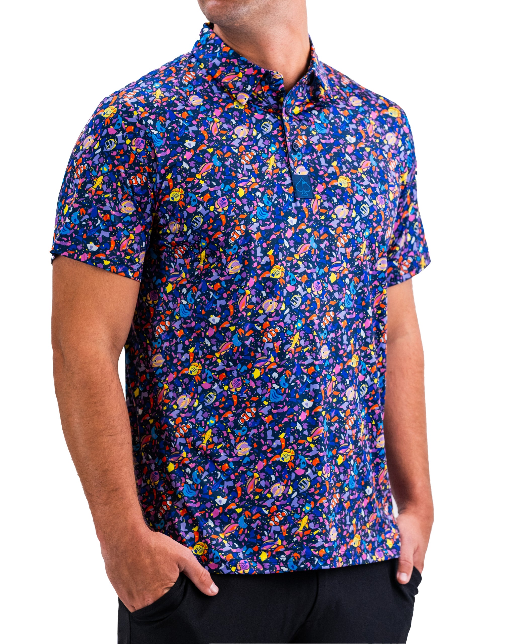 Colorful men's golf shirt with a vibrant, abstract fish pattern in blue, purple, yellow, and orange for bold course style.