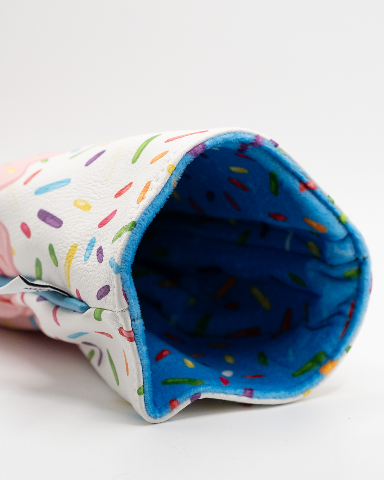Colorful driver cover featuring a playful sprinkle design and a soft blue interior, perfect for stylish golfers.