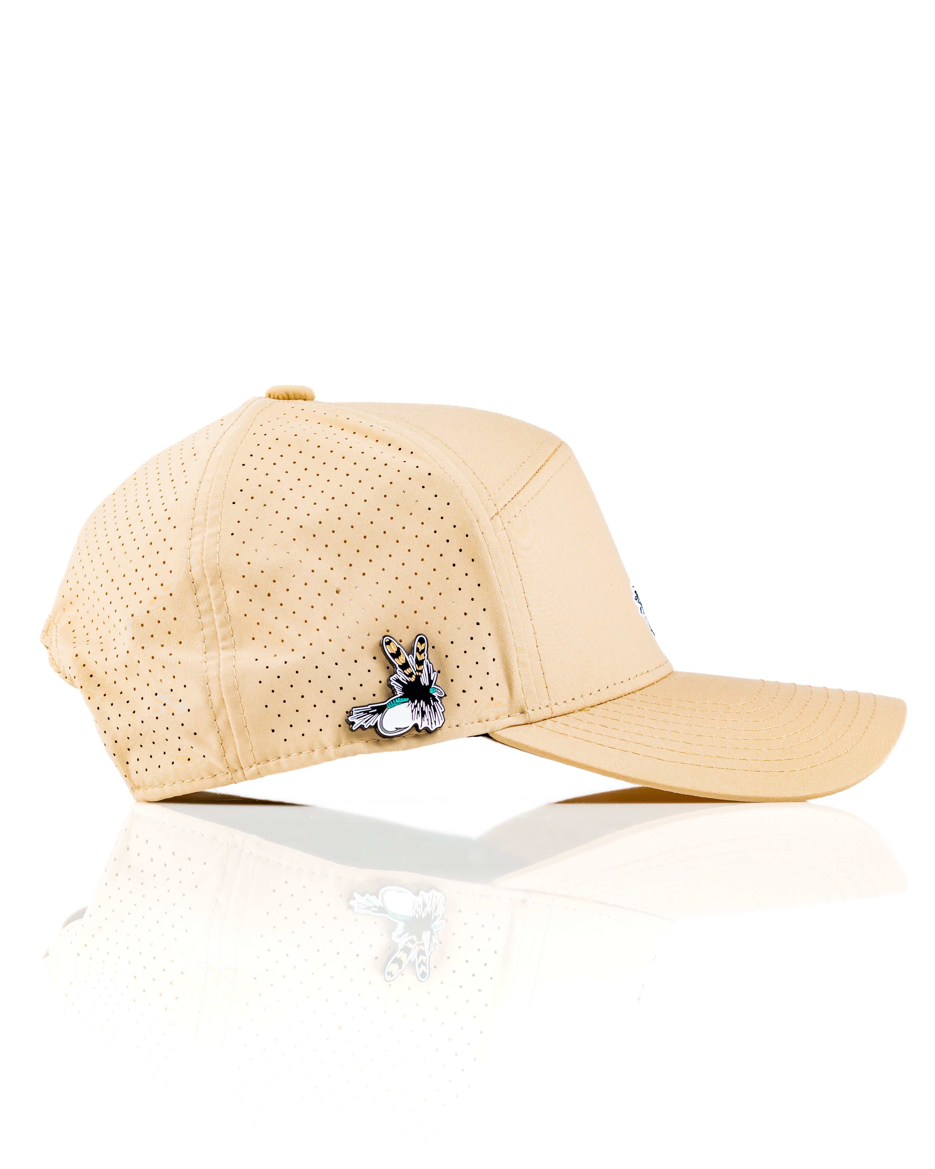 Light tan Tradesman Hat featuring a breathable design and a unique fly fishing pin, perfect for outdoor enthusiasts.