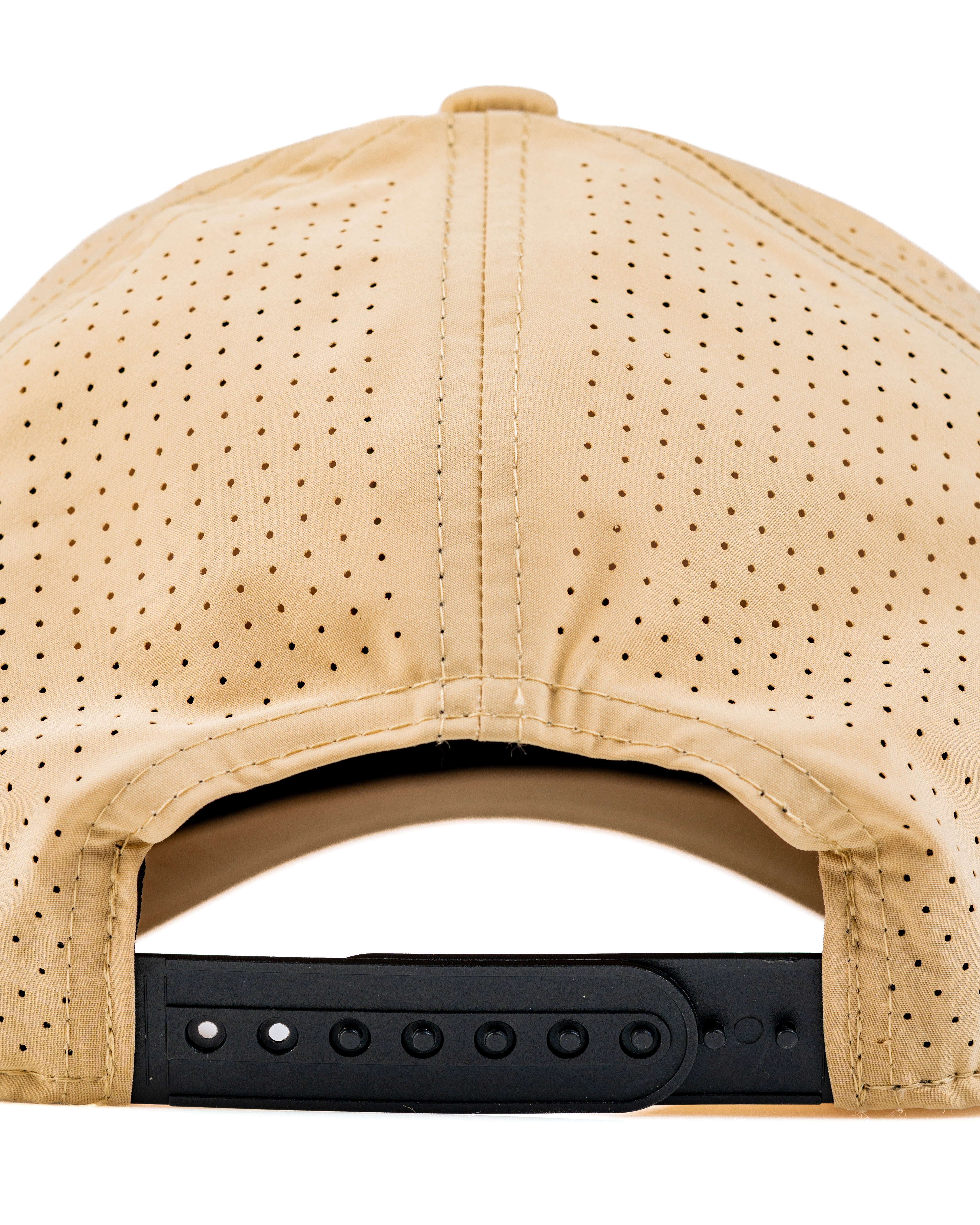 Back view of the Tradesman Hat in Dry Fly color, featuring perforated fabric and an adjustable strap for comfort.