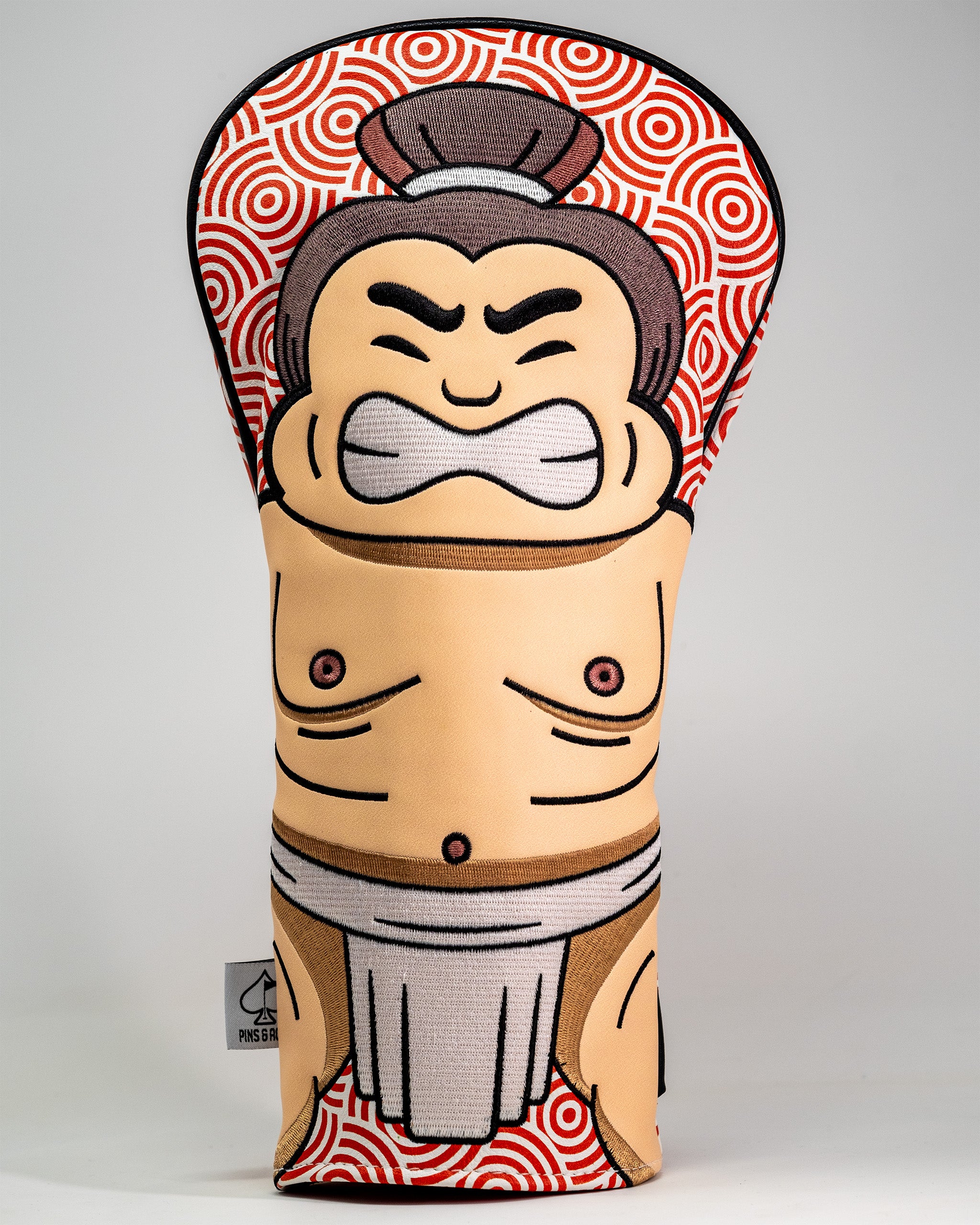 Sumo wrestler-themed driver cover with a cartoon face, muscular torso, and traditional loincloth design.