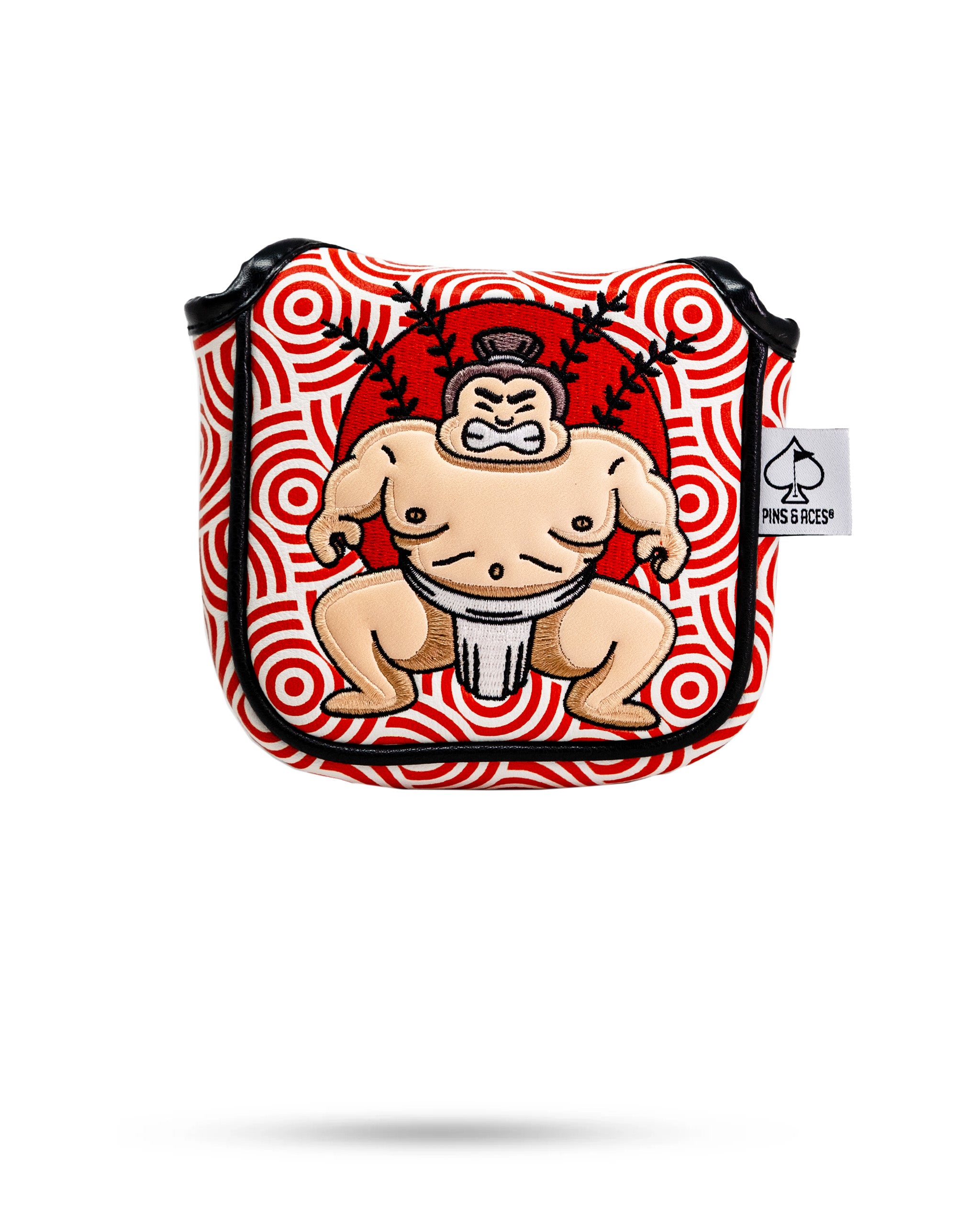 Sumo wrestler embroidered patch on a red and white patterned mallet putter cover with black piping and a Pins and Aces tag.