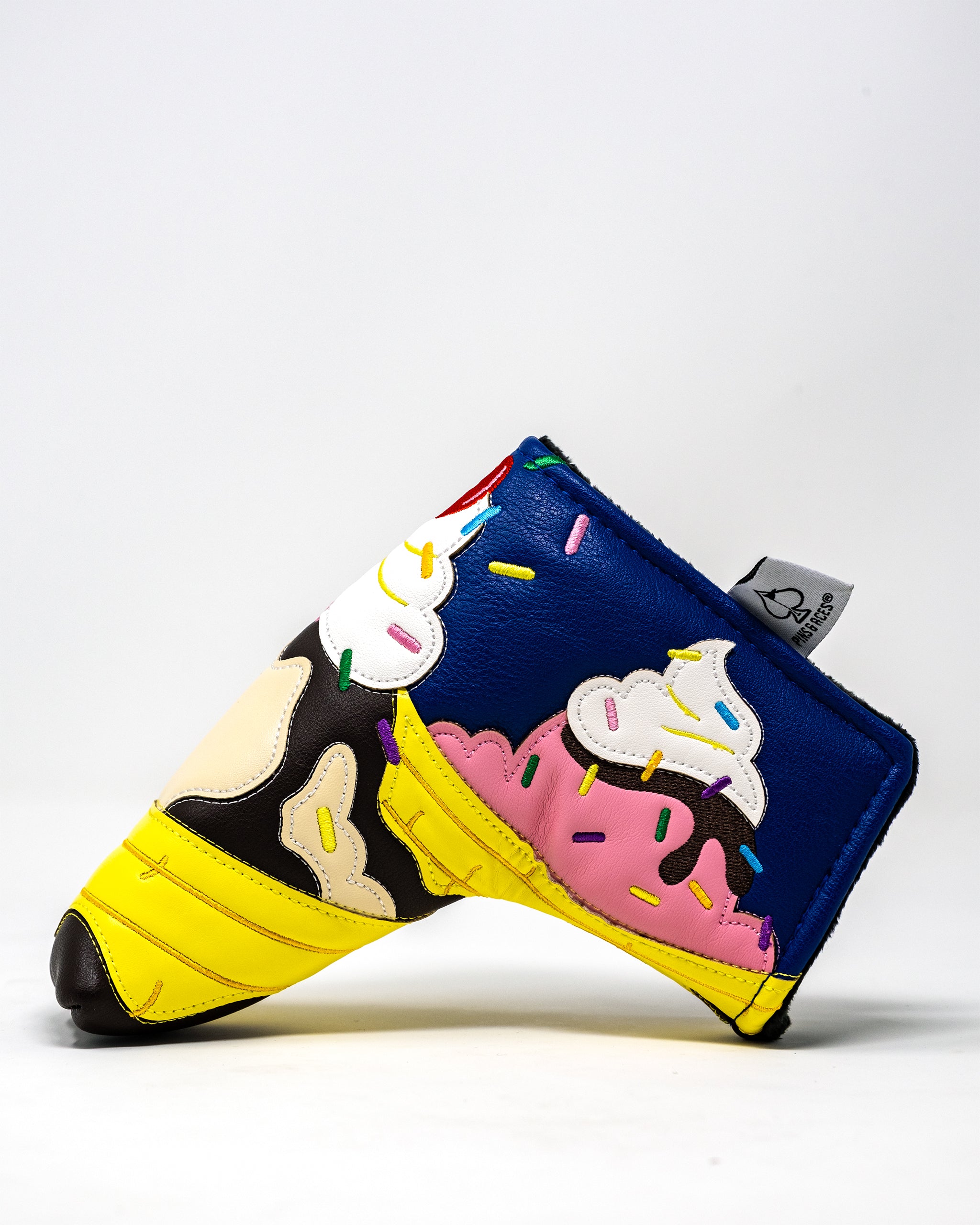 Colorful Banana Split blade putter cover featuring design elements of a banana split sundae, perfect for protecting golf putters.
