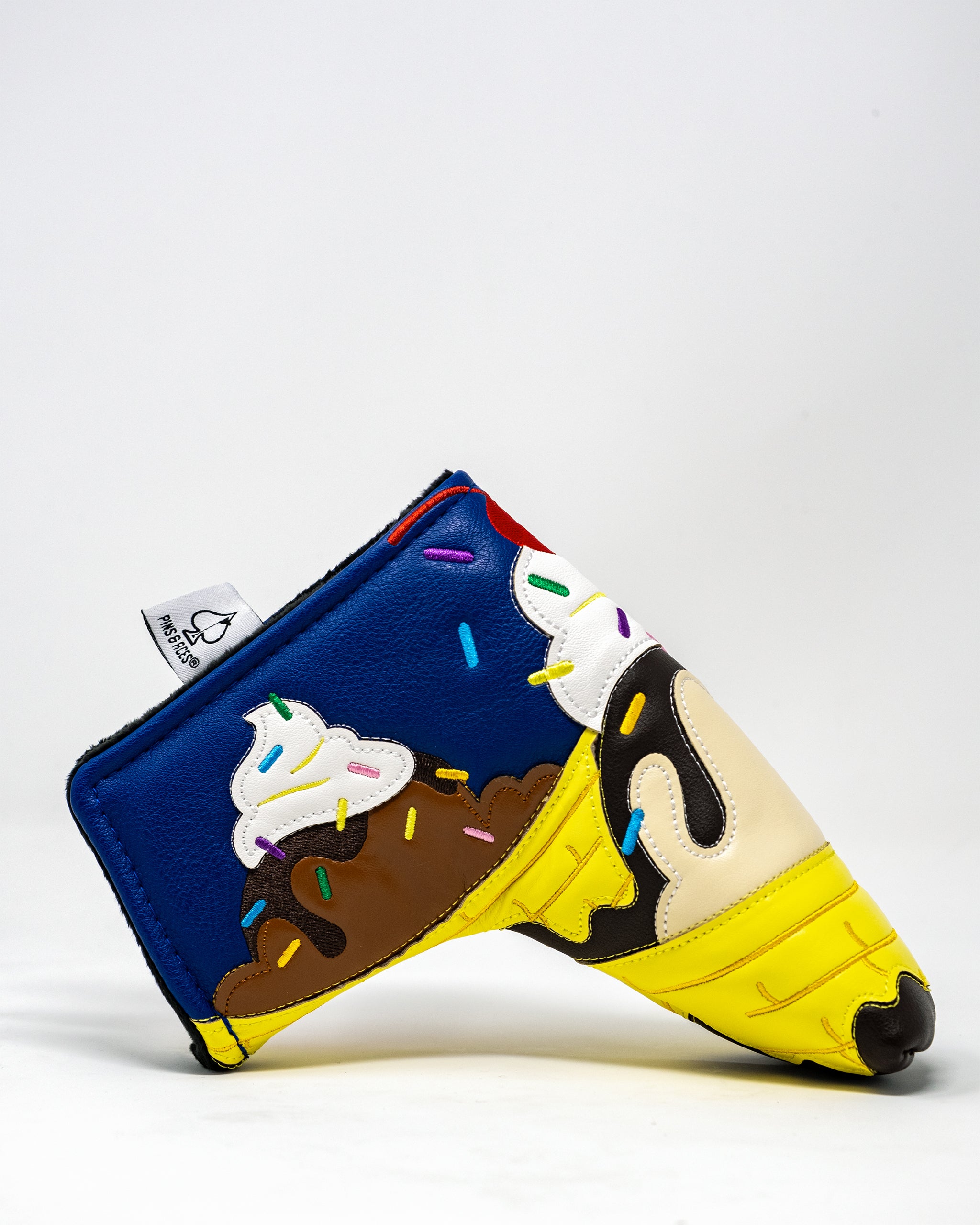 Alt text: Banana split-themed blade putter cover featuring vibrant colors and realistic ice cream design.