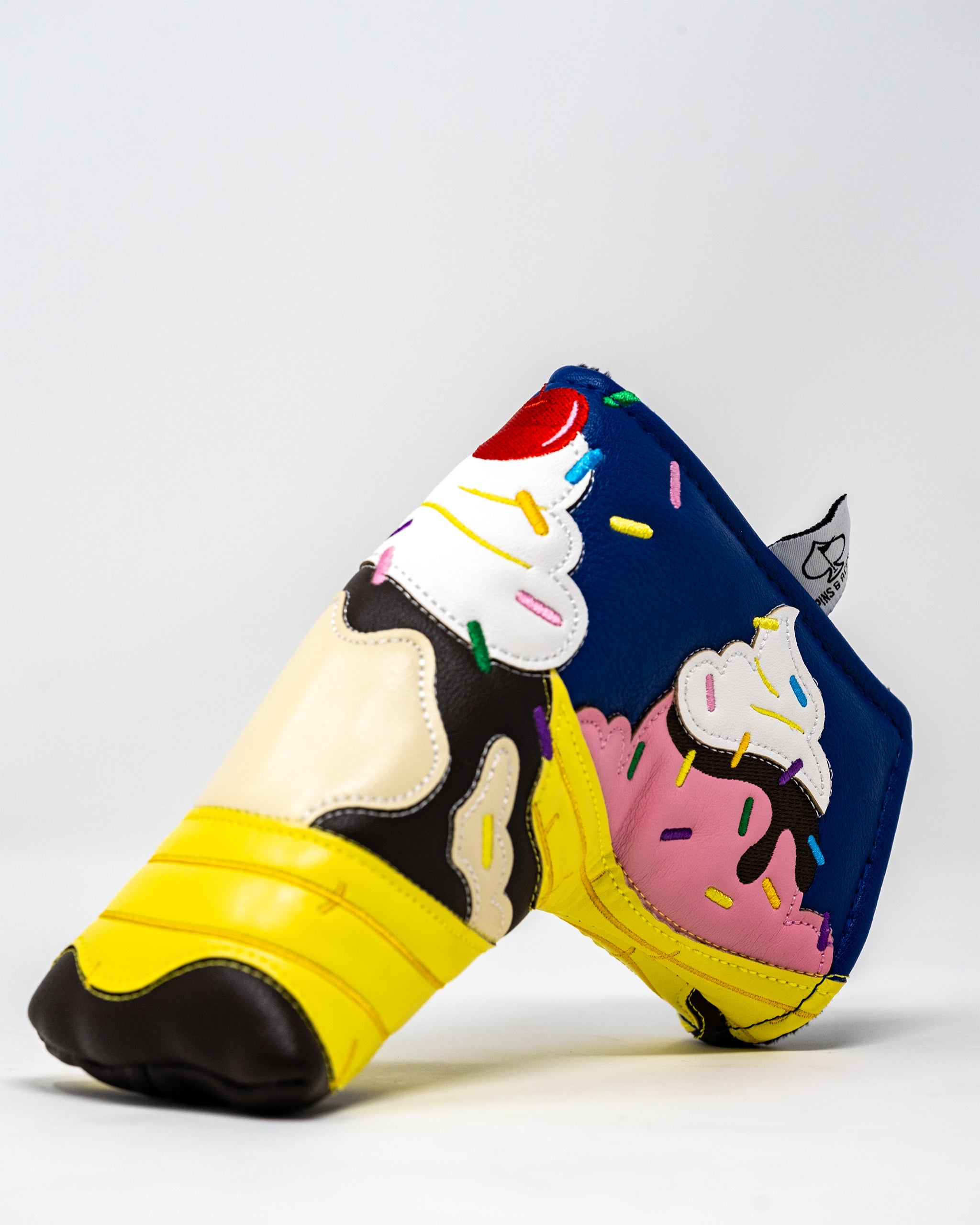Alt text: "Banana Split Blade Putter Cover featuring vibrant colors and detailed ice cream sundae design."