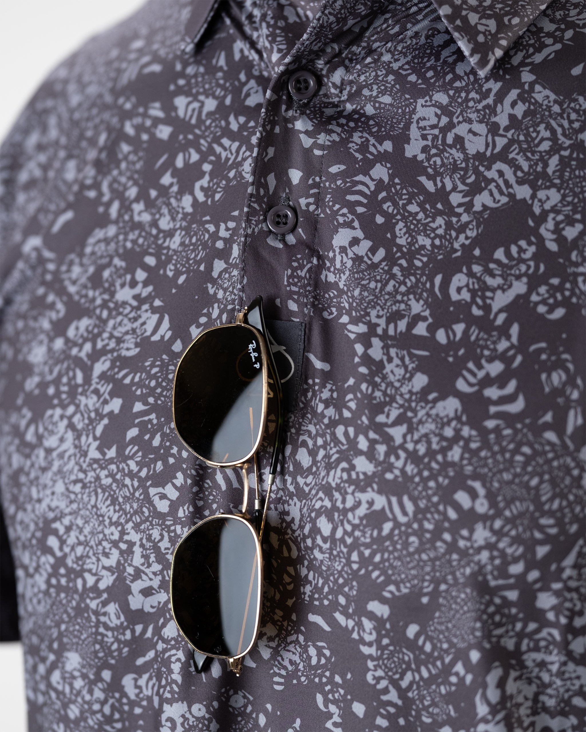 Volcanic ash-colored decorative sunglass holder with a textured finish.