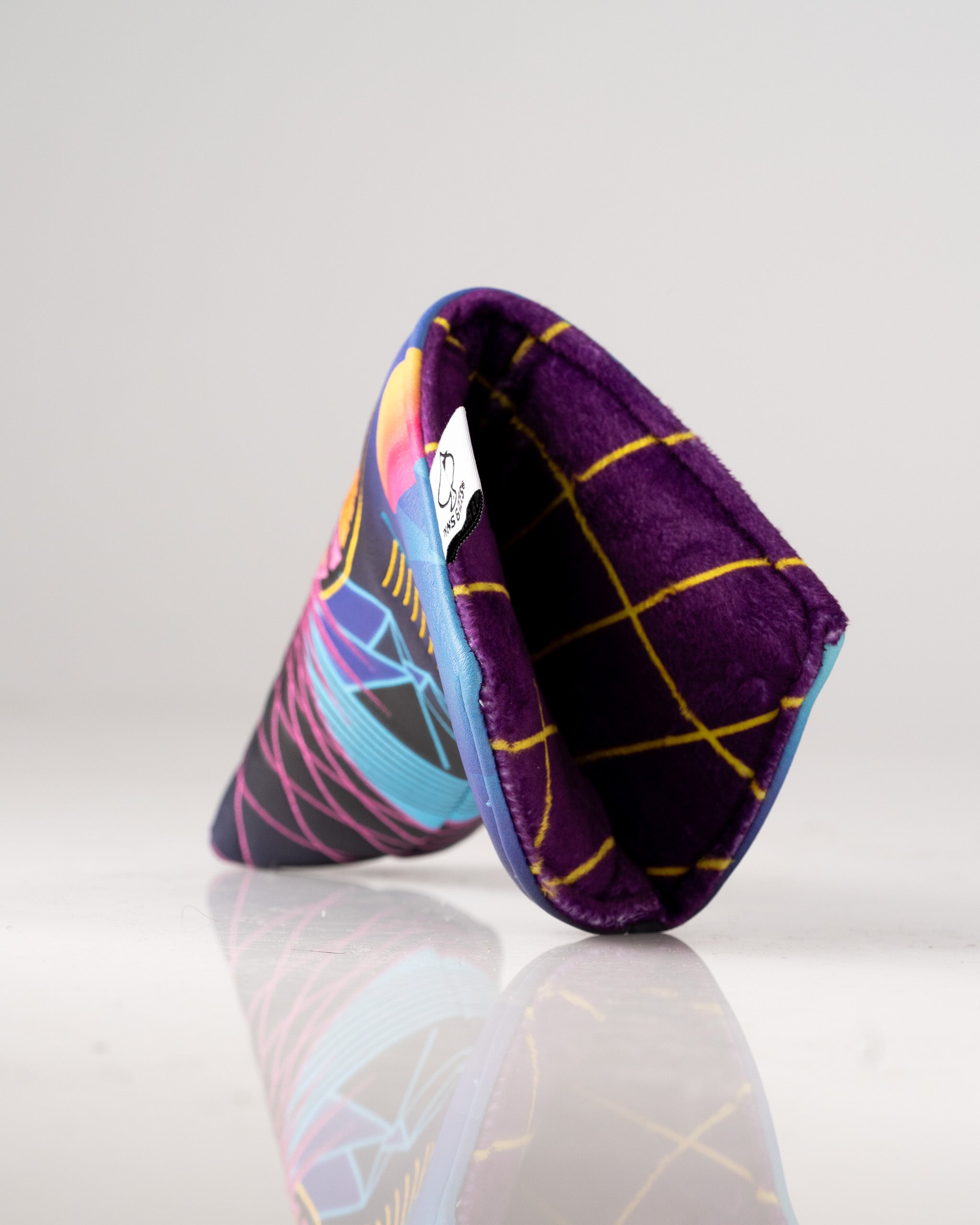 Vibrant Synthwave Blade Putter Cover featuring neon colors and a soft interior for stylish protection on the golf course.