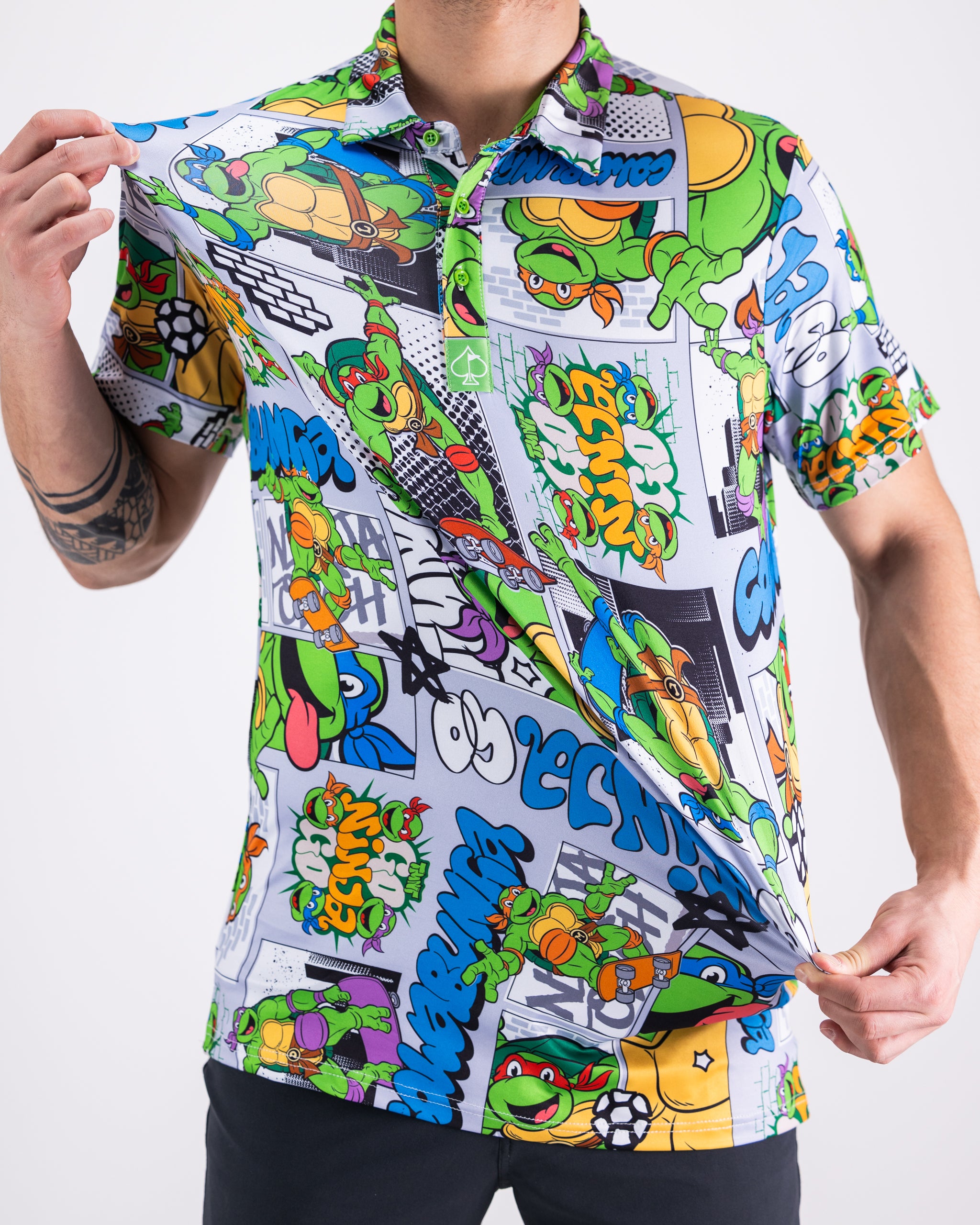 TMNT comic strip design featuring iconic Teenage Mutant Ninja Turtles characters printed on a polo shirt.