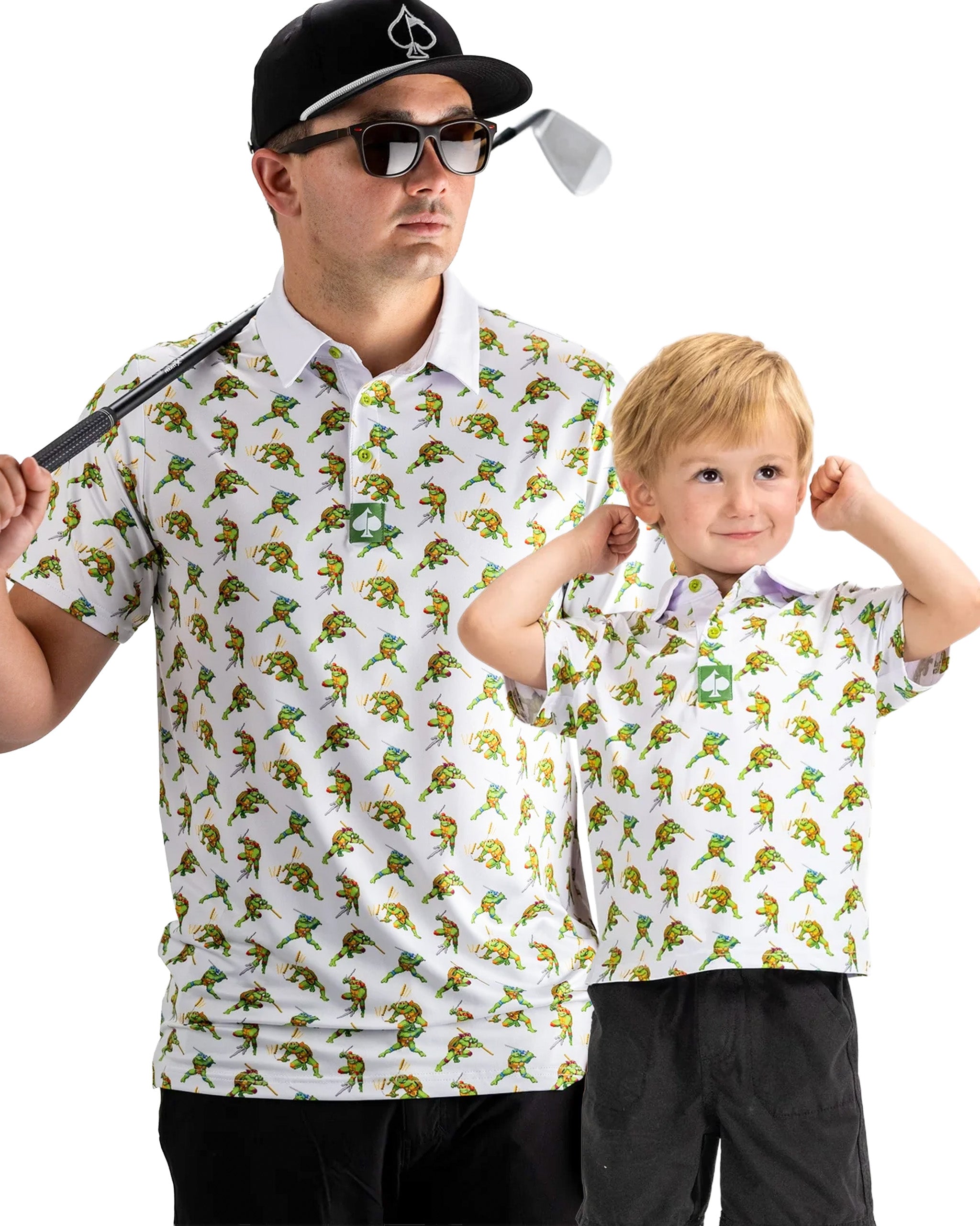 Father and son wearing matching TMNT Cowabunga Classic 8-Bit polos featuring vibrant turtle graphics, perfect for golf outings.