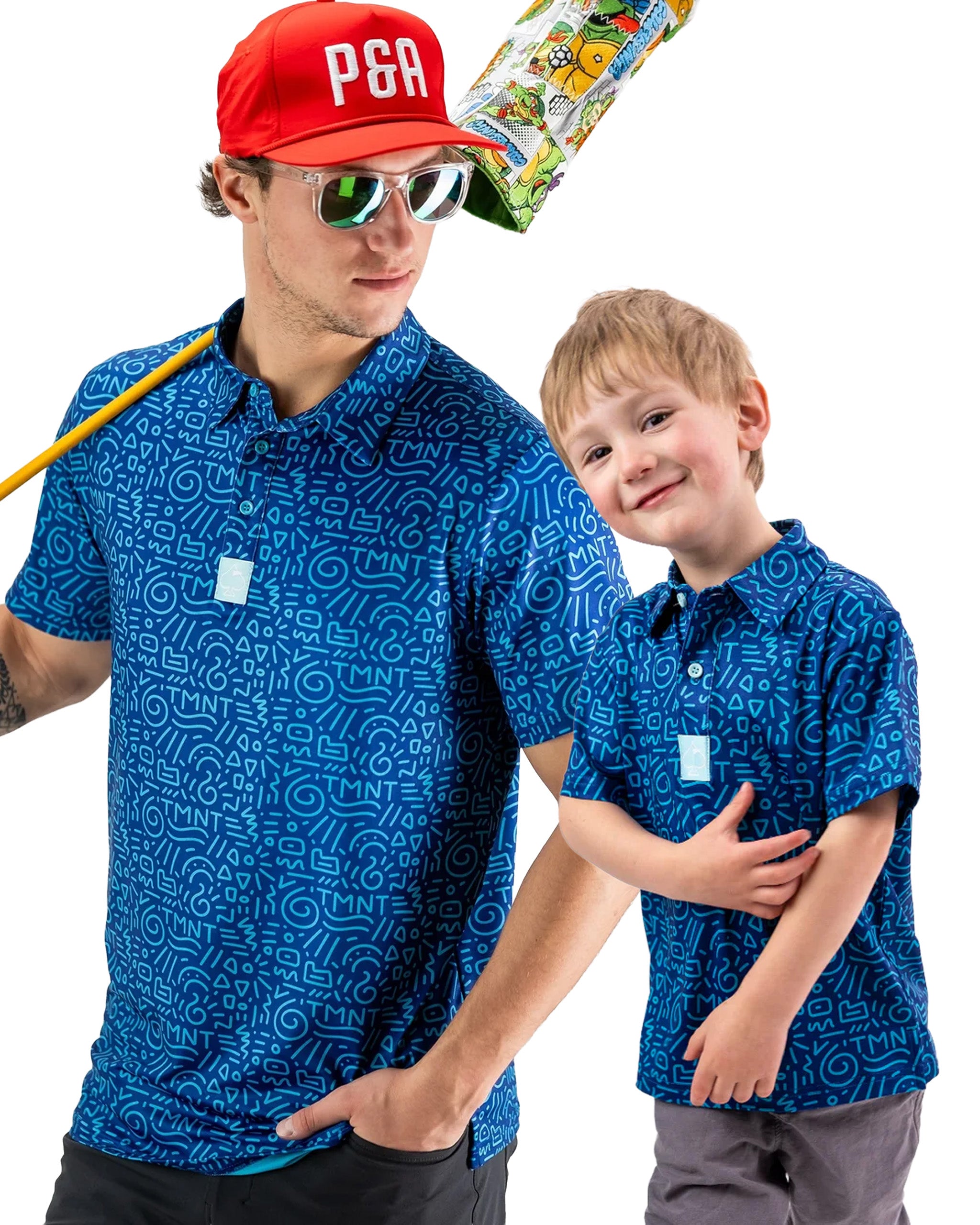 Father and son wearing matching blue TMNT doodle polos, showcasing a fun and playful design perfect for family outings.
