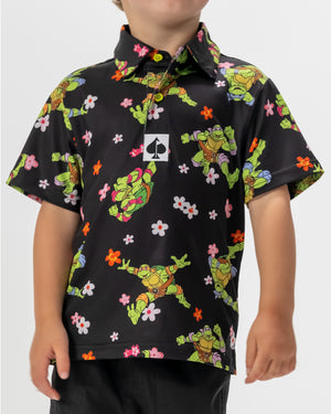 TMNT Youth Turtle Flower Power polo shirt featuring colorful turtle and floral designs.