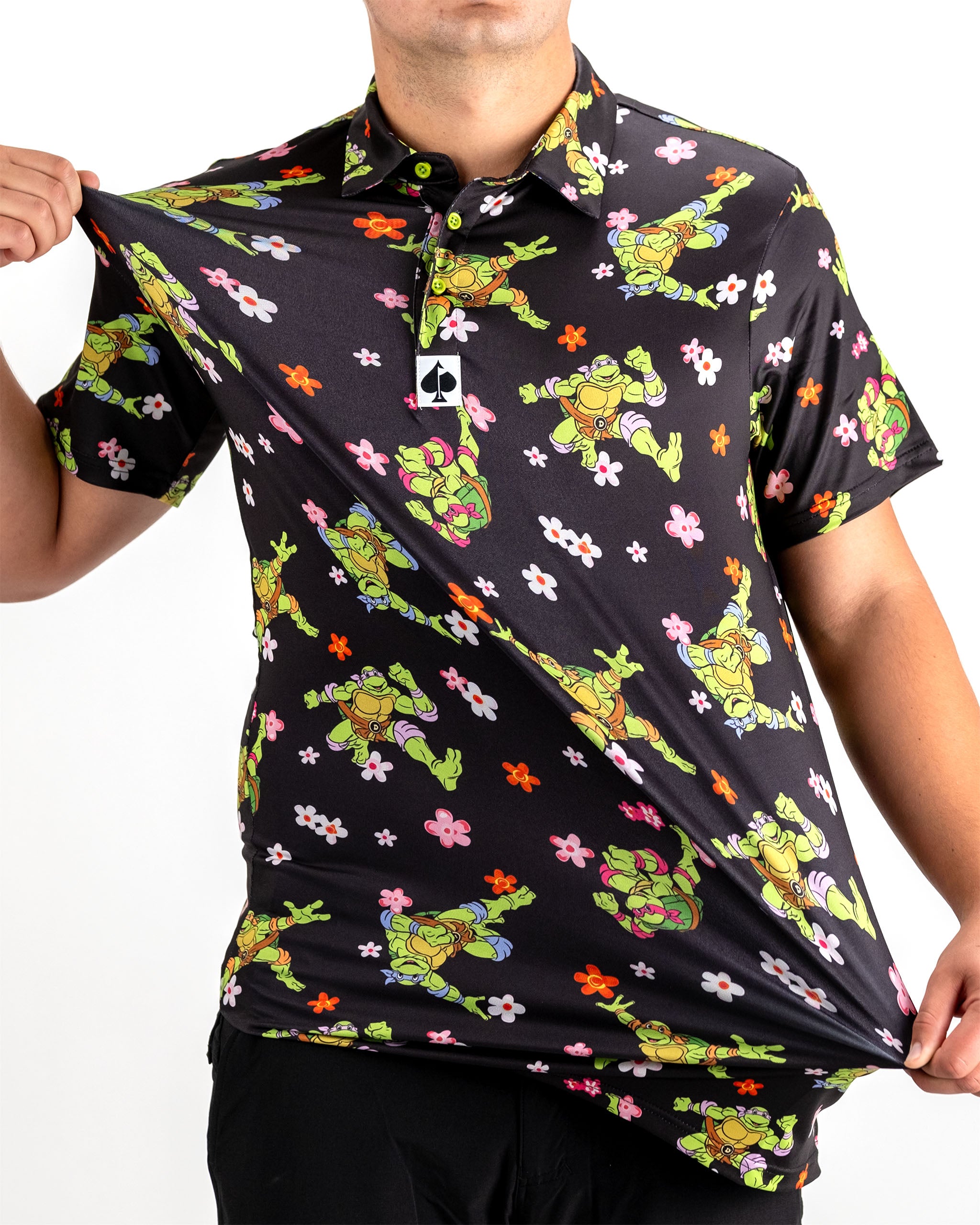 TMNT Turtle Flower Power graphic t-shirt featuring iconic Teenage Mutant Ninja Turtles design with vibrant floral elements.