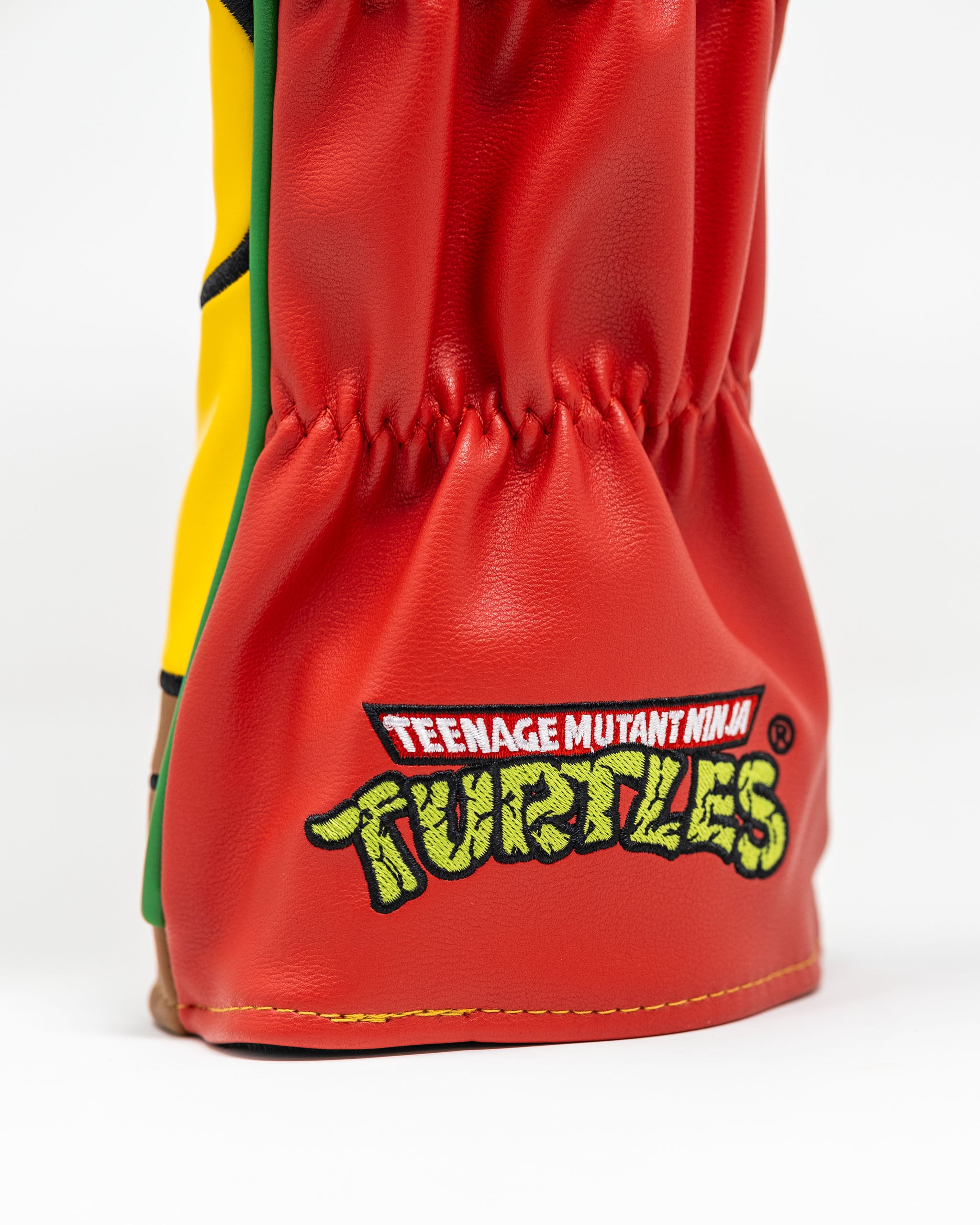TMNT Raphael driver cover featuring a vibrant design of the character's face, ideal for golf enthusiasts and Teenage Mutant Ninja Turtles fans.