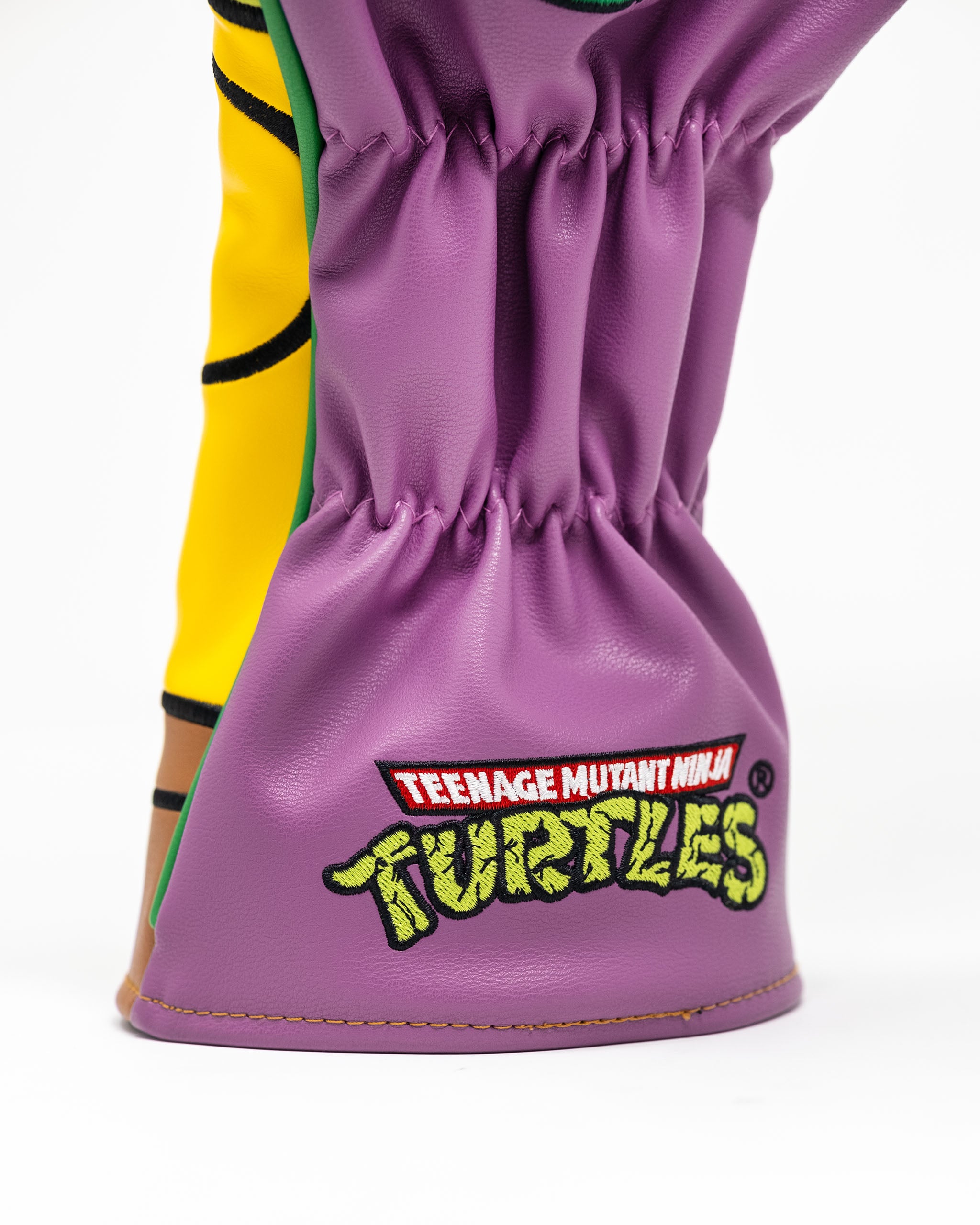 TMNT Donatello driver cover featuring a vibrant purple design with Donatello's face and signature bo staff.