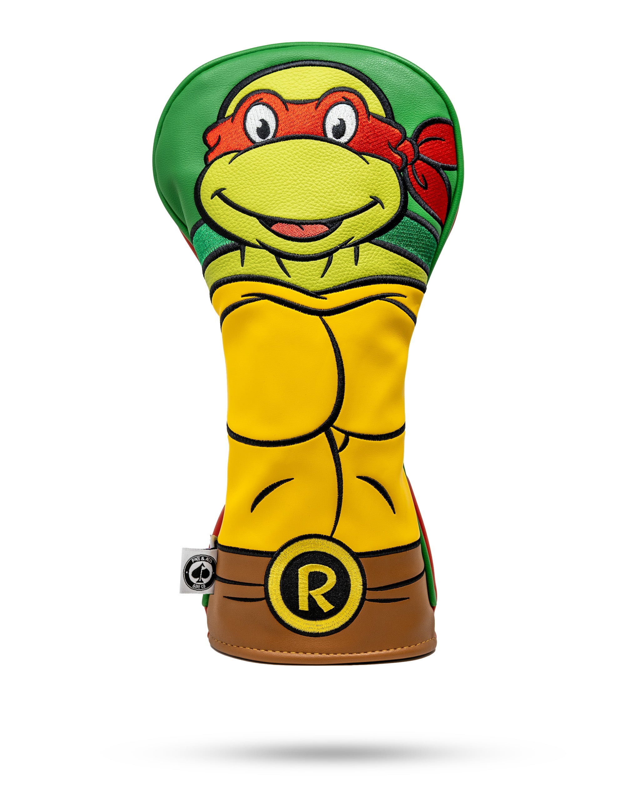 Colorful Teenage Mutant Ninja Turtle golf headcover with yellow, green, red, and brown, featuring a playful design for bol...