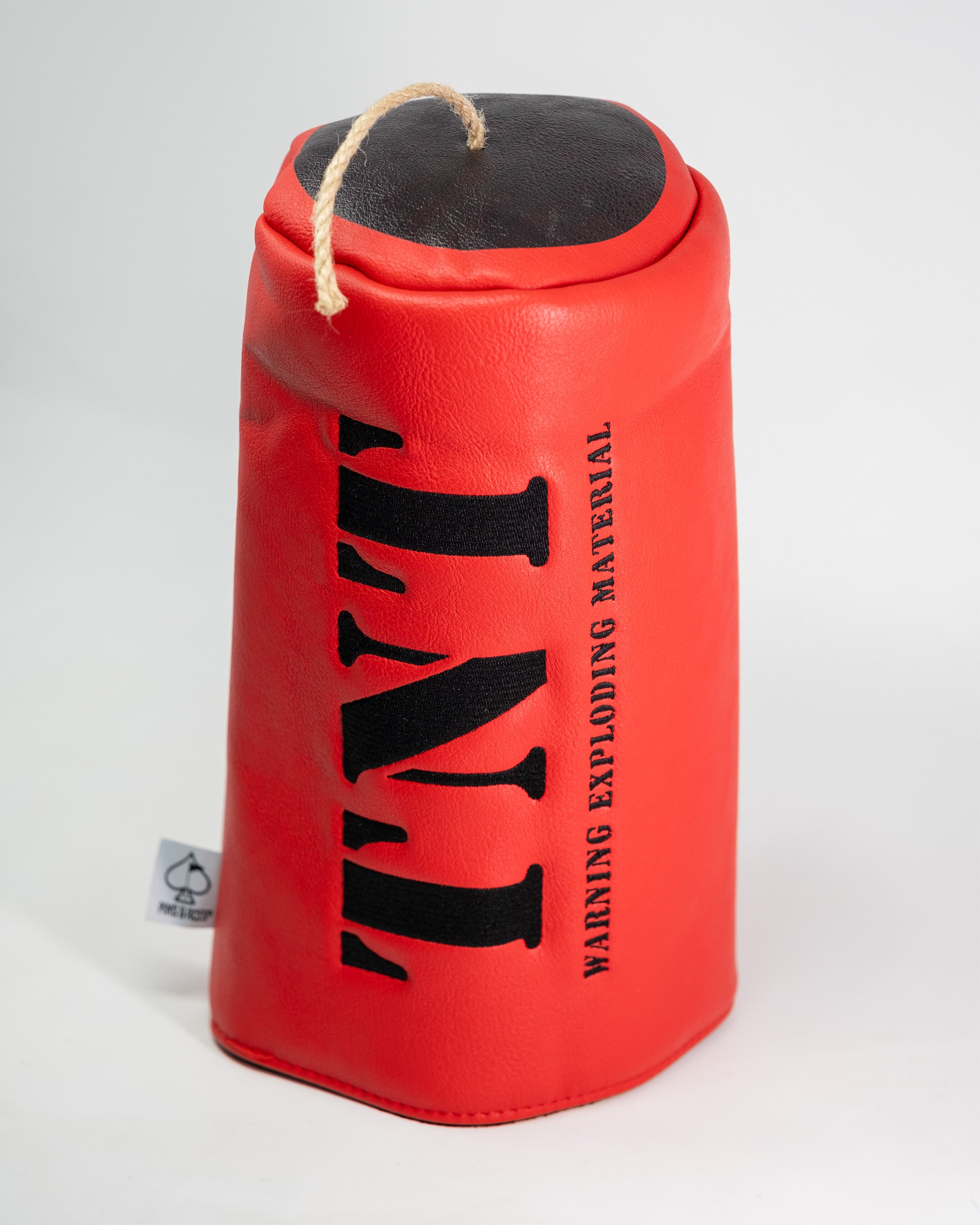Red driver cover with black lettering that says TNT and warning about exploding material, designed for golf club protection.