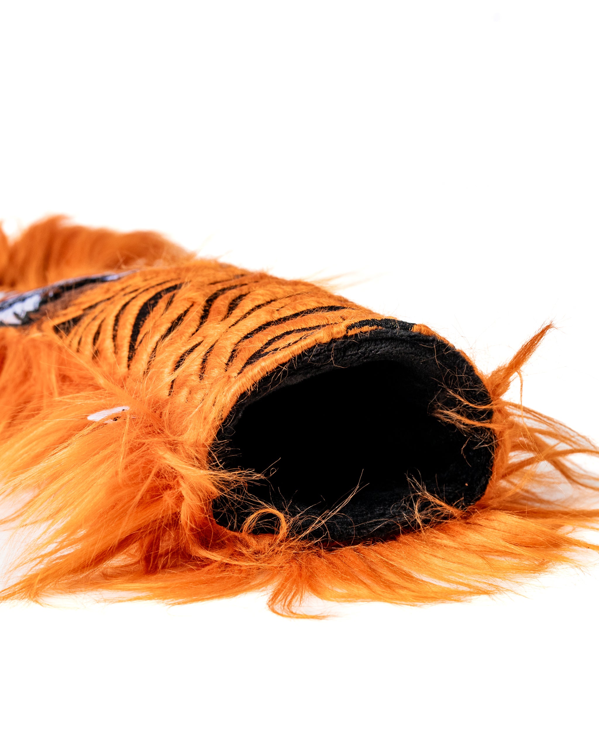 Bold orange tiger fairway cover featuring a furry design and black stripes, perfect for golfers wanting to stand out.