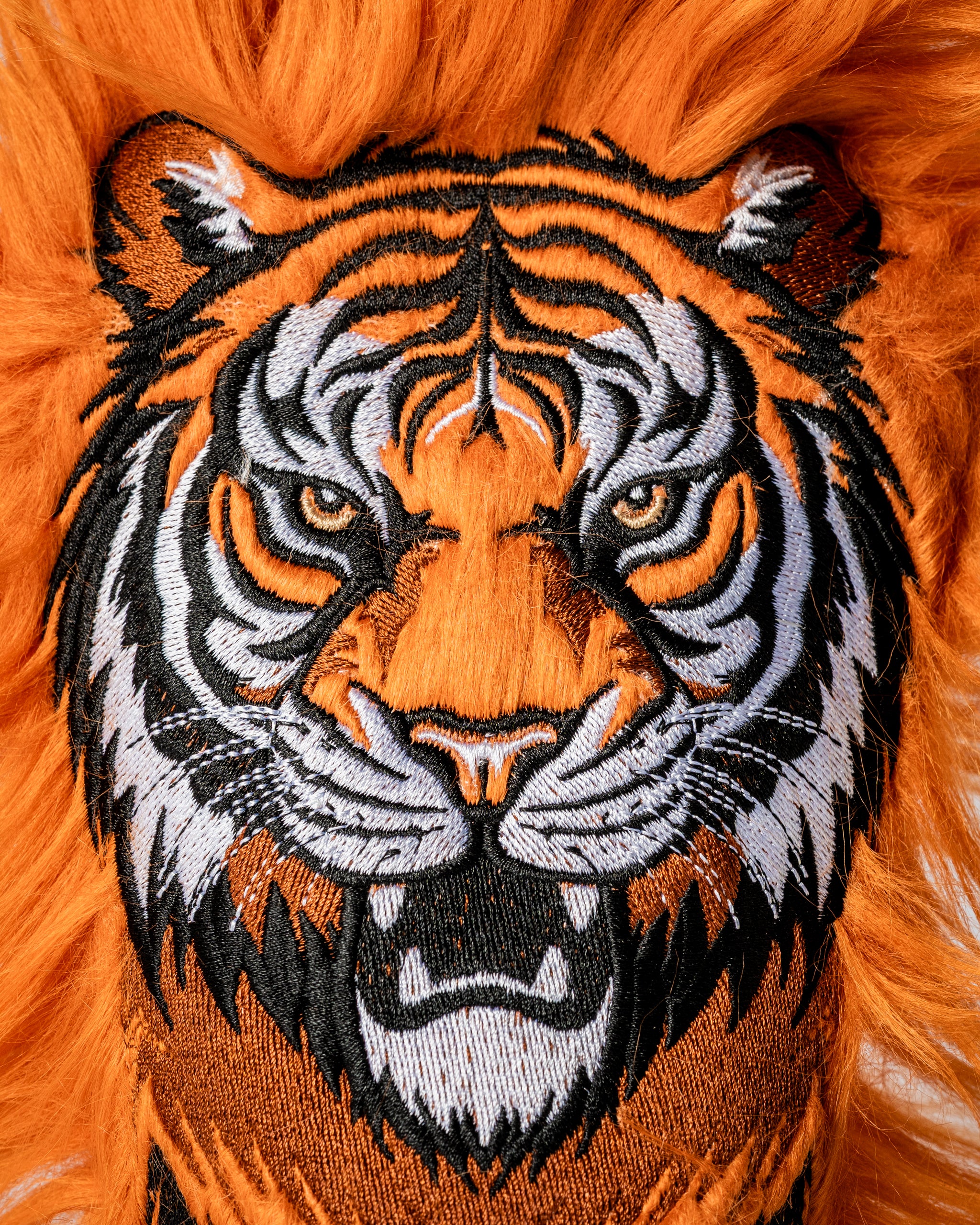 Bold tiger fairway cover featuring intricate embroidery and vibrant orange fur, perfect for golfers wanting to stand out.