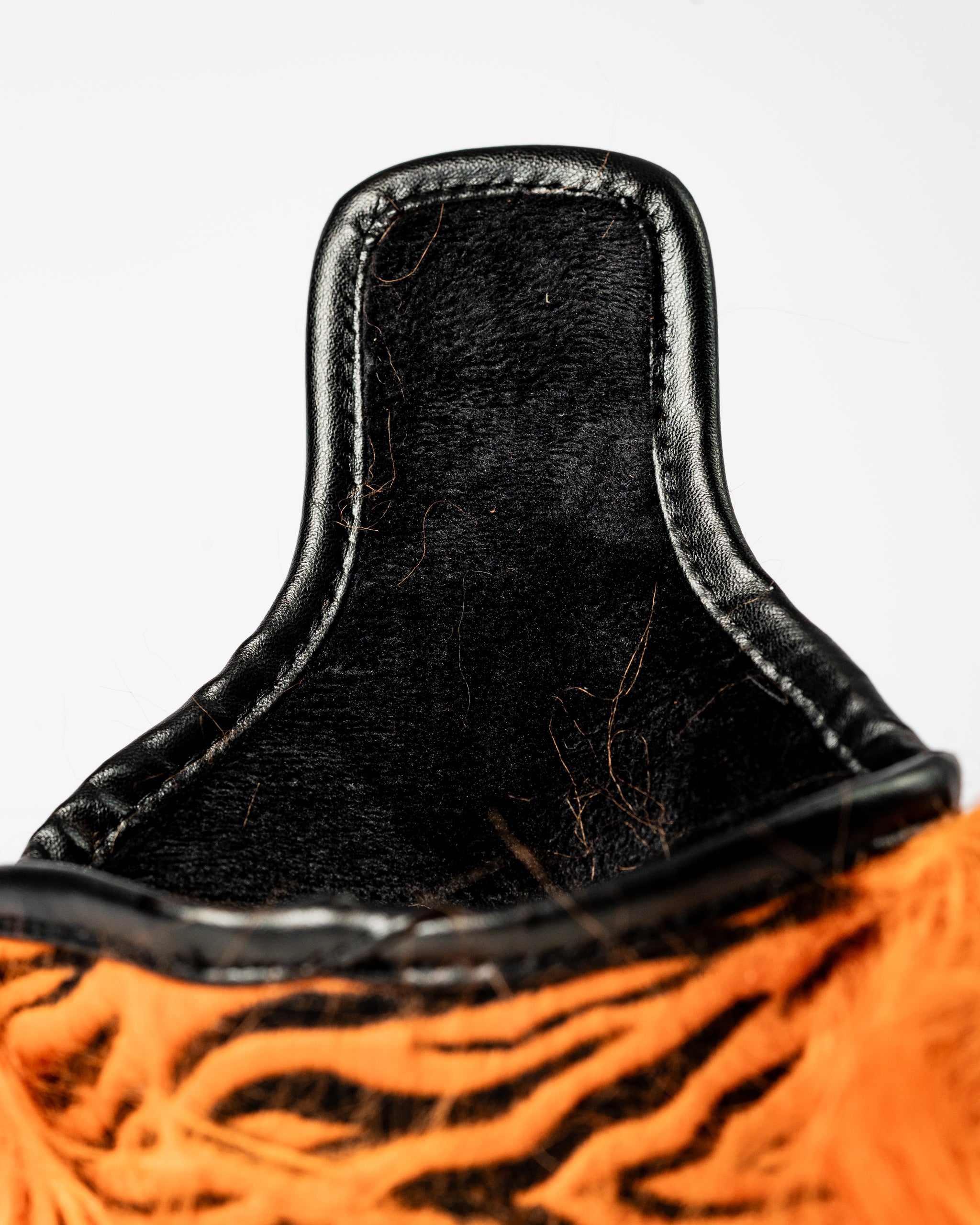 Bold tiger-striped mallet putter cover with a soft black interior, designed for golfers wanting to stand out on the course.