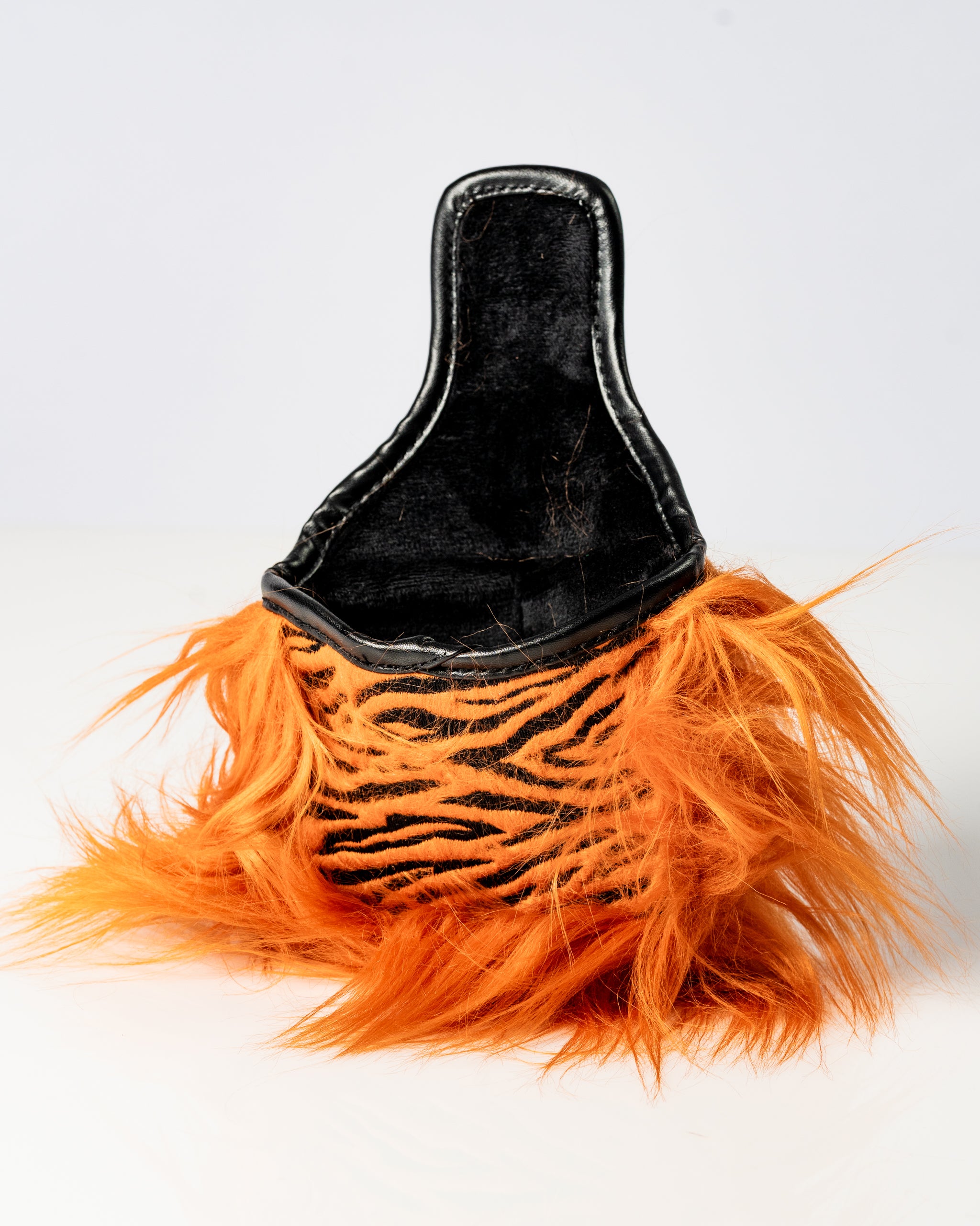 Bold tiger-striped mallet putter cover with vibrant orange fur, designed to make a statement on the golf course.