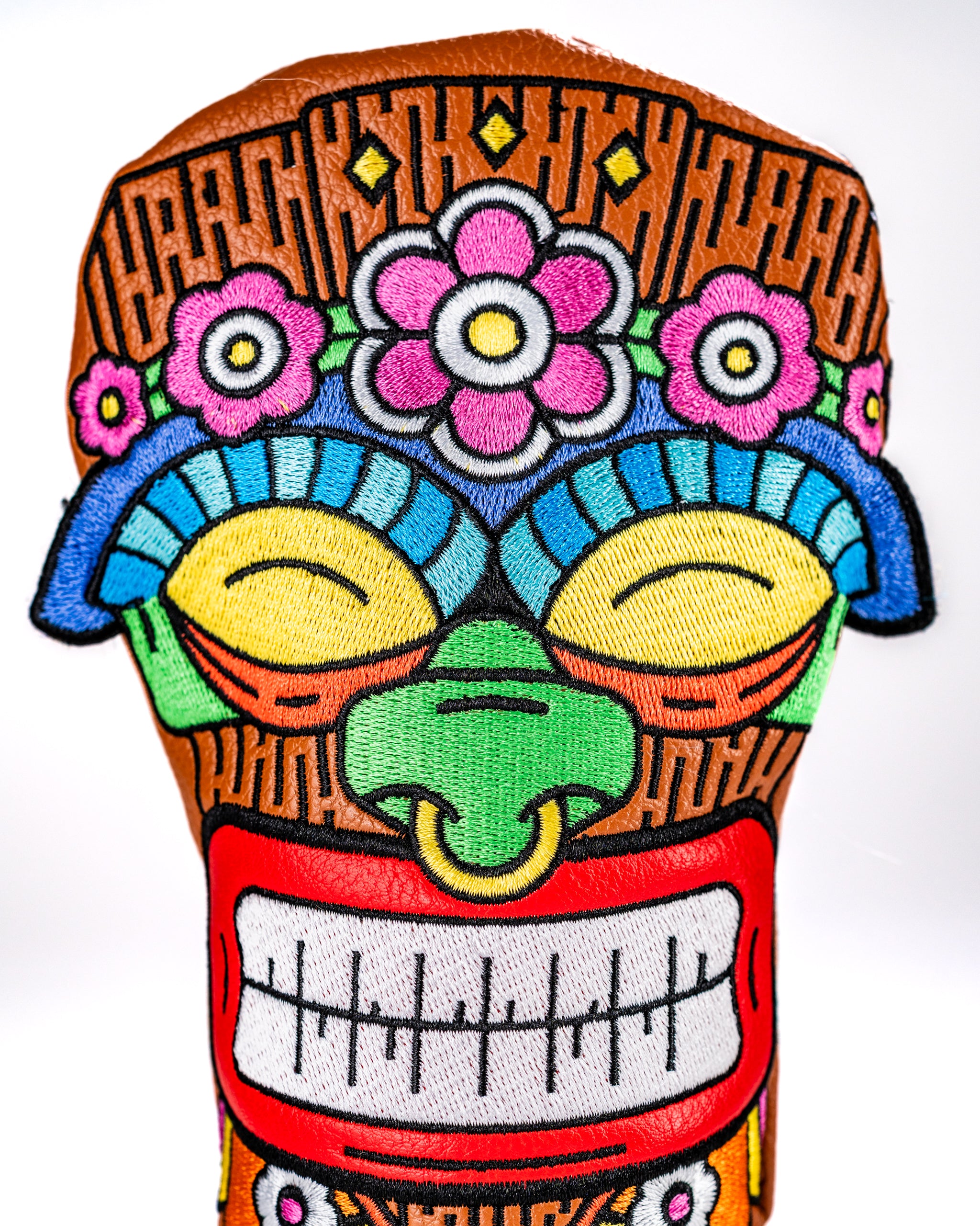 Vibrant Tiki headcover featuring colorful floral and tribal designs, perfect for adding personality to golf clubs.