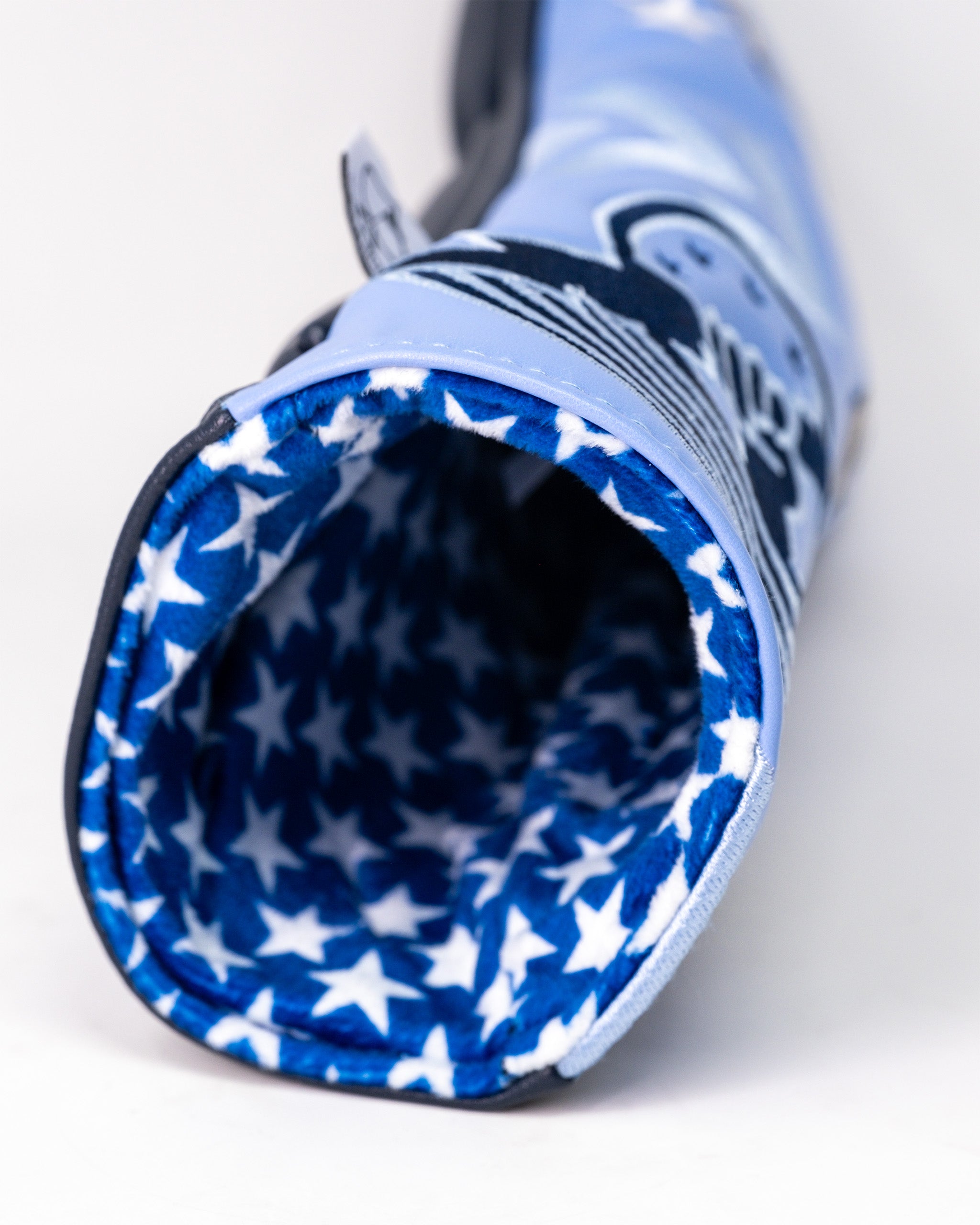 Ice Man Top Gun themed golf fairway headcover with a blue exterior and a star-patterned interior lining.