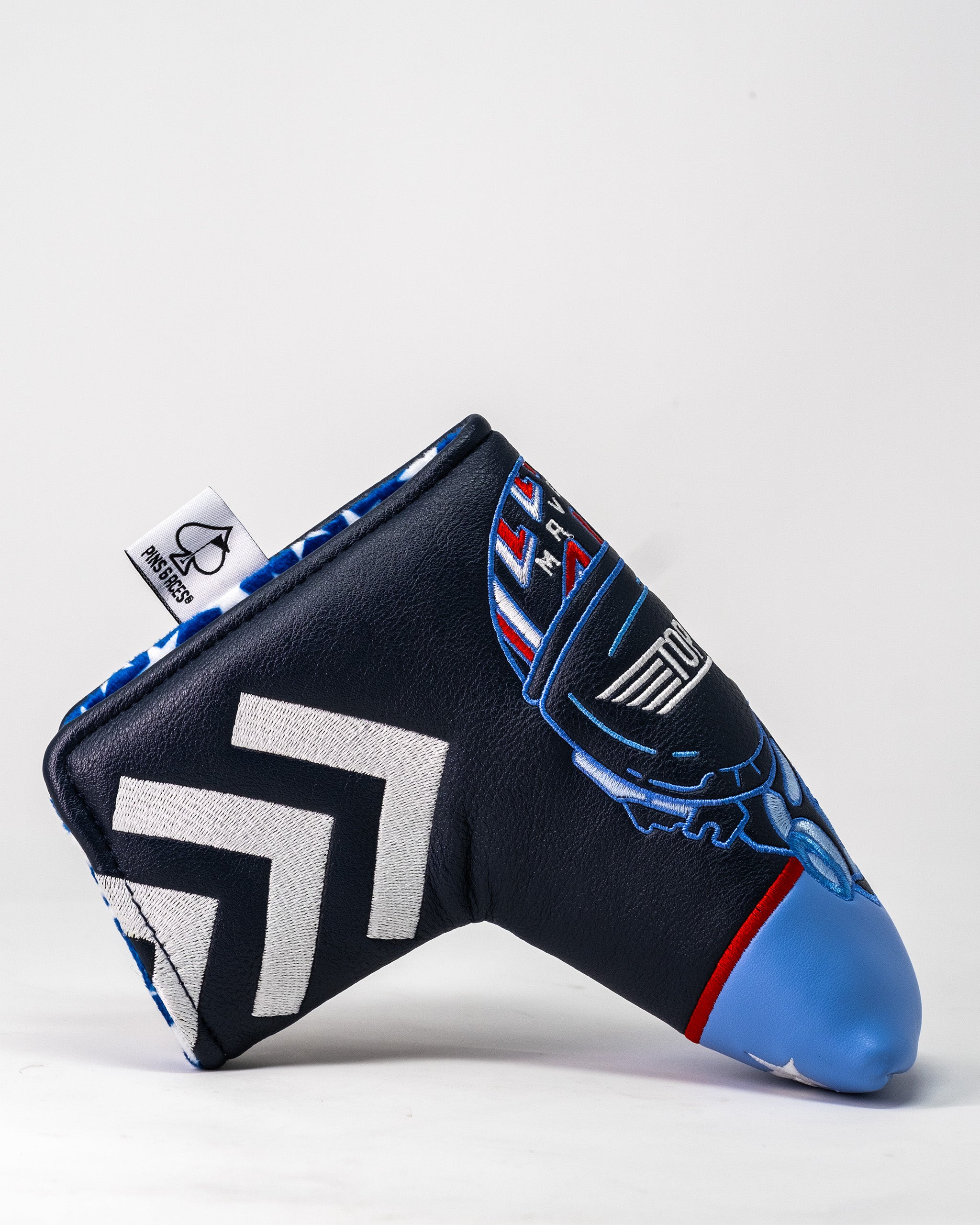 Golf club headcover featuring a Top Gun Maverick aircraft design with blue, black, white, and red embroidered details.
